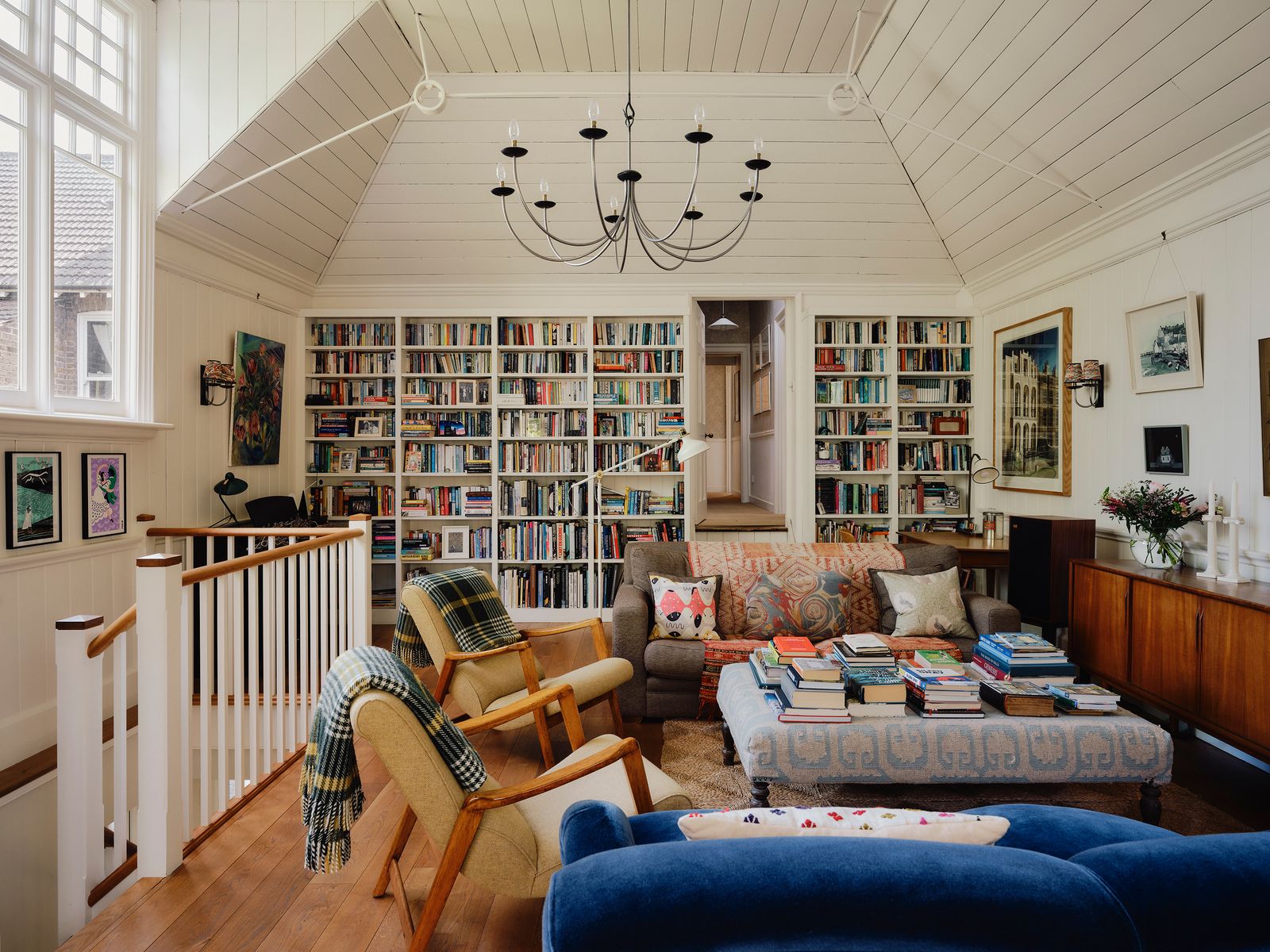 Image may contain Chair Furniture Couch Home Decor Lamp Architecture Building Indoors Living Room Room and Art