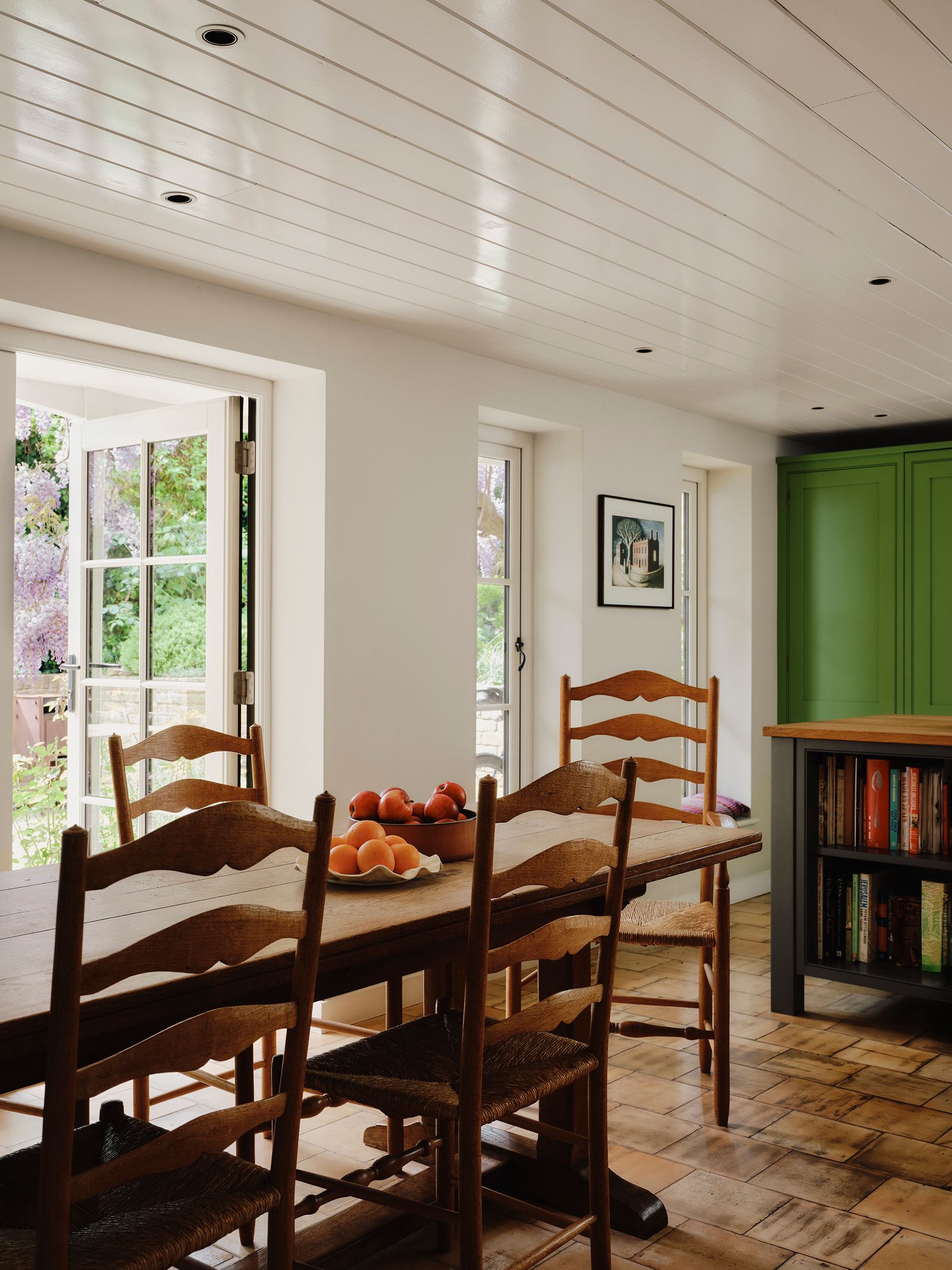 Image may contain Architecture Building Dining Room Dining Table Furniture Indoors Room Table and Door