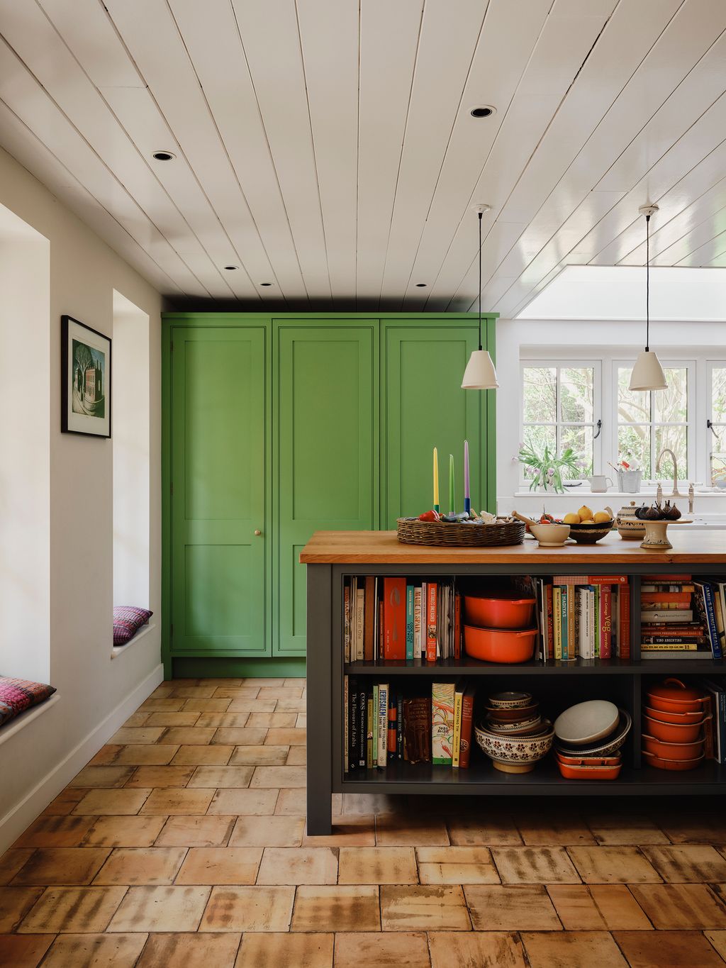 Image may contain Indoors Interior Design Lamp Wood Furniture Art Painting Hardwood Stained Wood and Bookcase