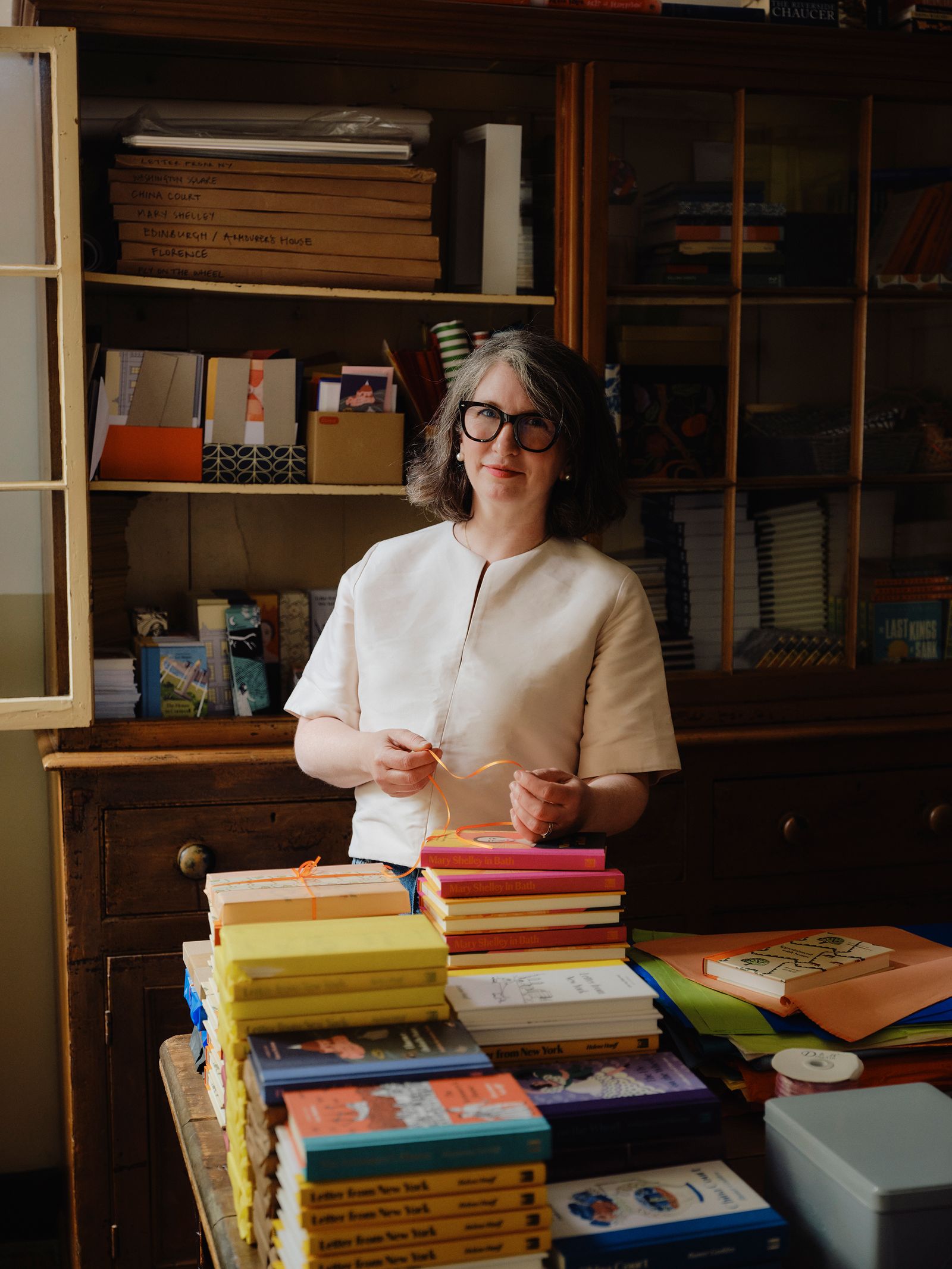 Image may contain Luanne Rice Shelf Adult Person Book Publication Accessories Glasses Furniture and Indoors