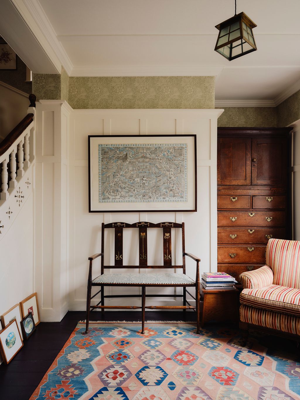 Image may contain Home Decor Lamp Architecture Building Furniture Indoors Living Room Room Art Painting and Rug