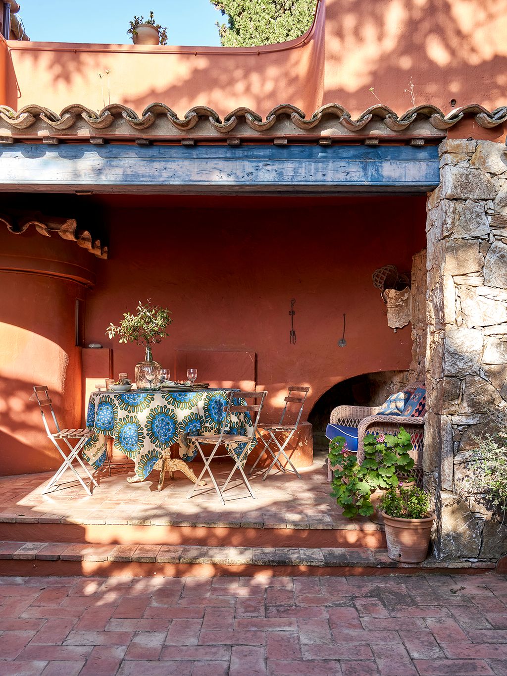 Image may contain Path Walkway Flagstone Architecture Building House Housing Villa Plant Potted Plant and Chair