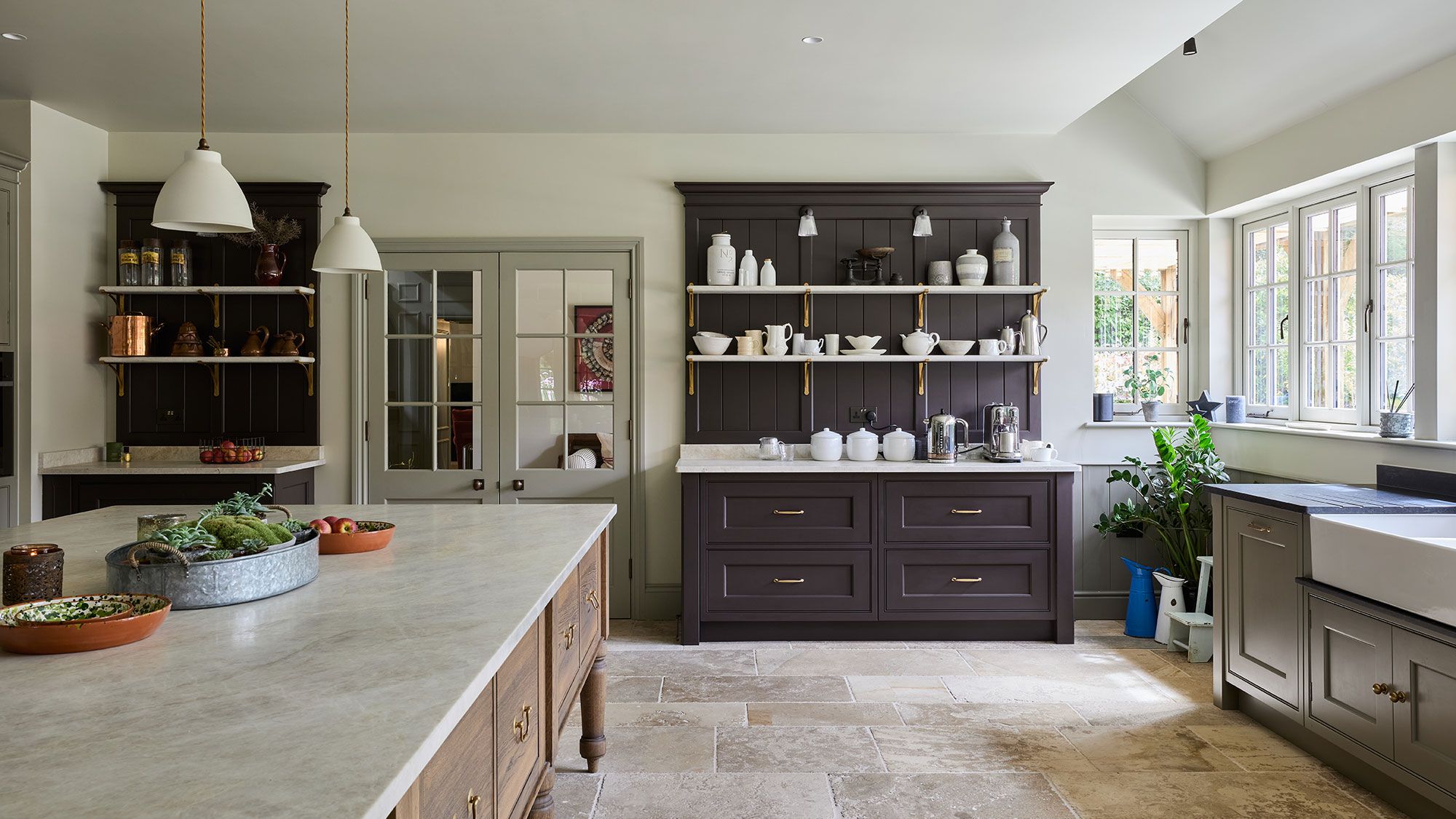 Image may contain: Indoors, Interior Design, Kitchen, Plant, Sink, Home Decor, Cabinet, Furniture, Floor, and Kitchen Island