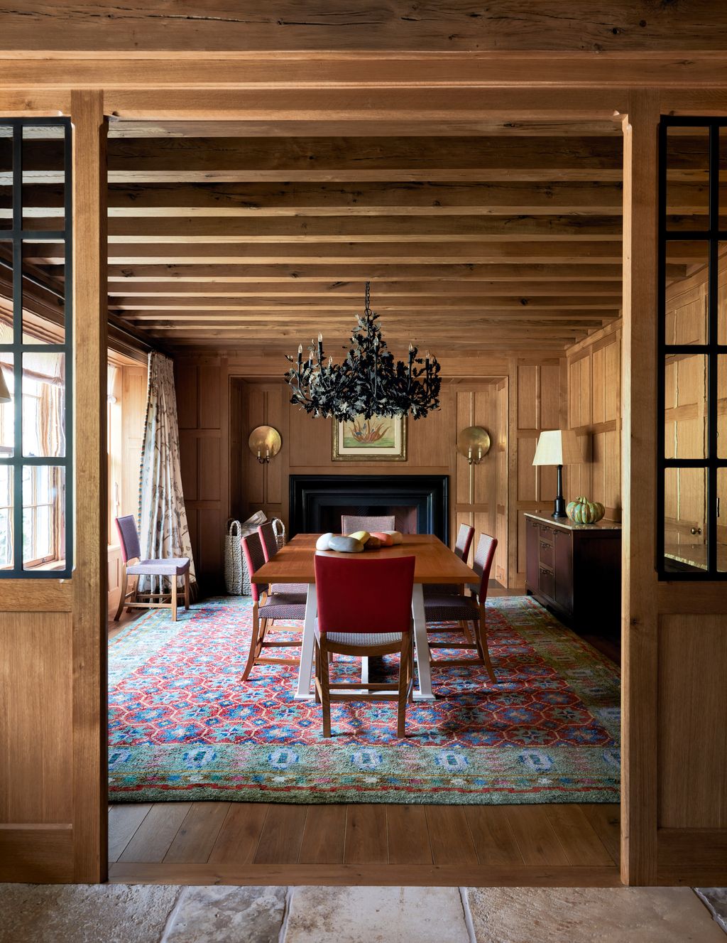 Image may contain Indoors Interior Design Chair Furniture Home Decor Chandelier Lamp Wood Rug and Floor