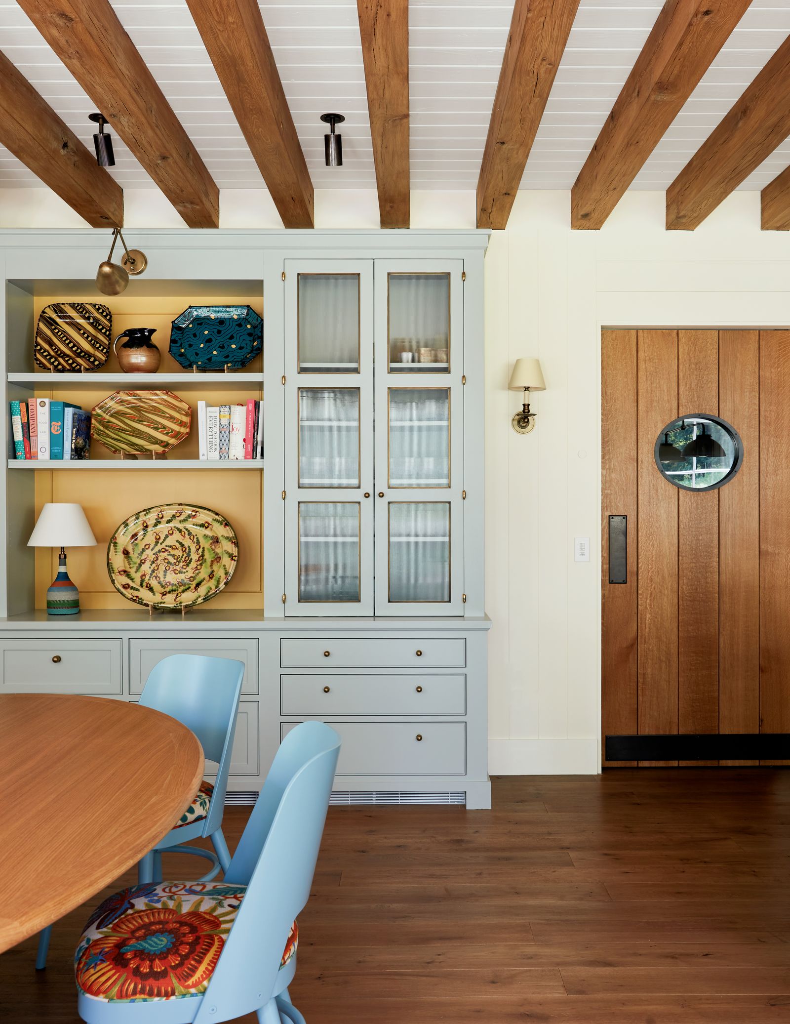 Image may contain Indoors Interior Design Lamp Wood Chair Furniture Hardwood Desk Table and Stained Wood