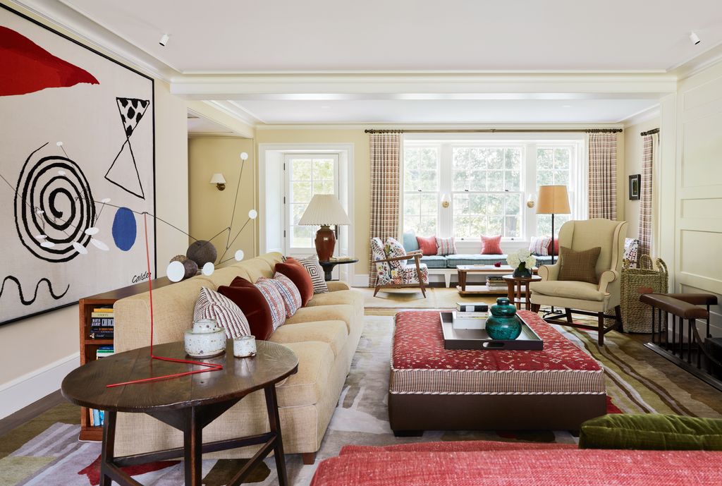 Image may contain Home Decor Lamp Architecture Building Furniture Indoors Living Room Room Couch and Table