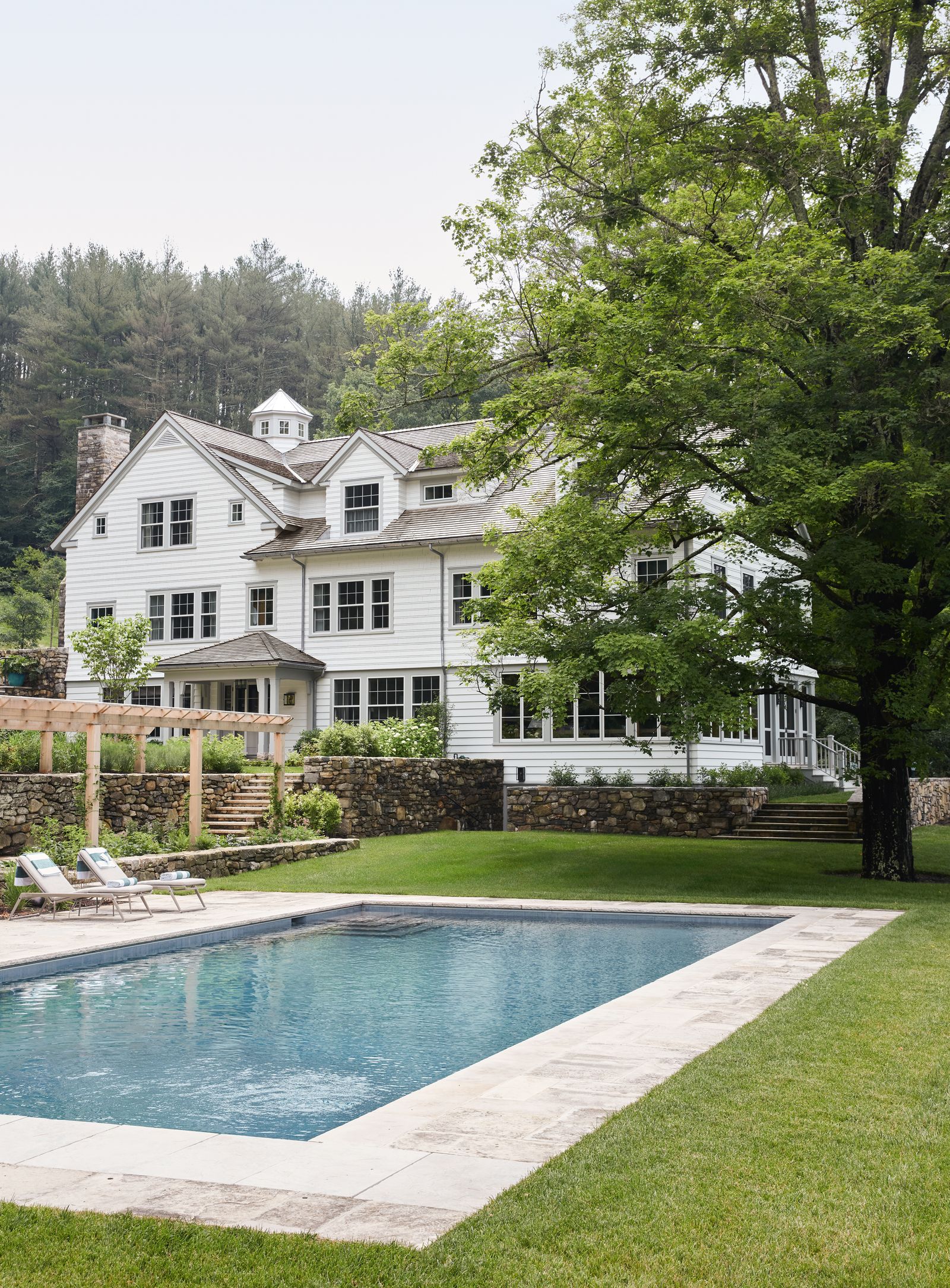 Image may contain Grass Plant Backyard Nature Outdoors Yard Pool Water Chair Furniture Architecture and Building