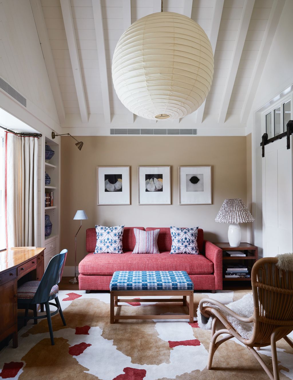 Image may contain Home Decor Lamp Architecture Building Furniture Indoors Living Room Room Chair Couch and Art