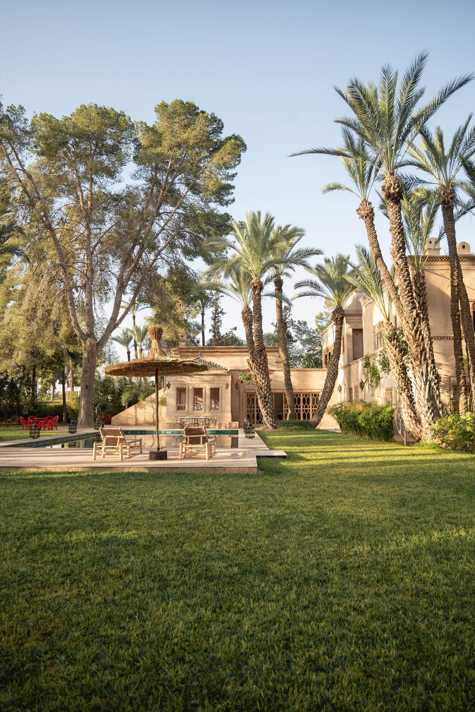 Image may contain Architecture Building House Housing Villa Grass Plant Lawn Tree Summer Bench and Furniture