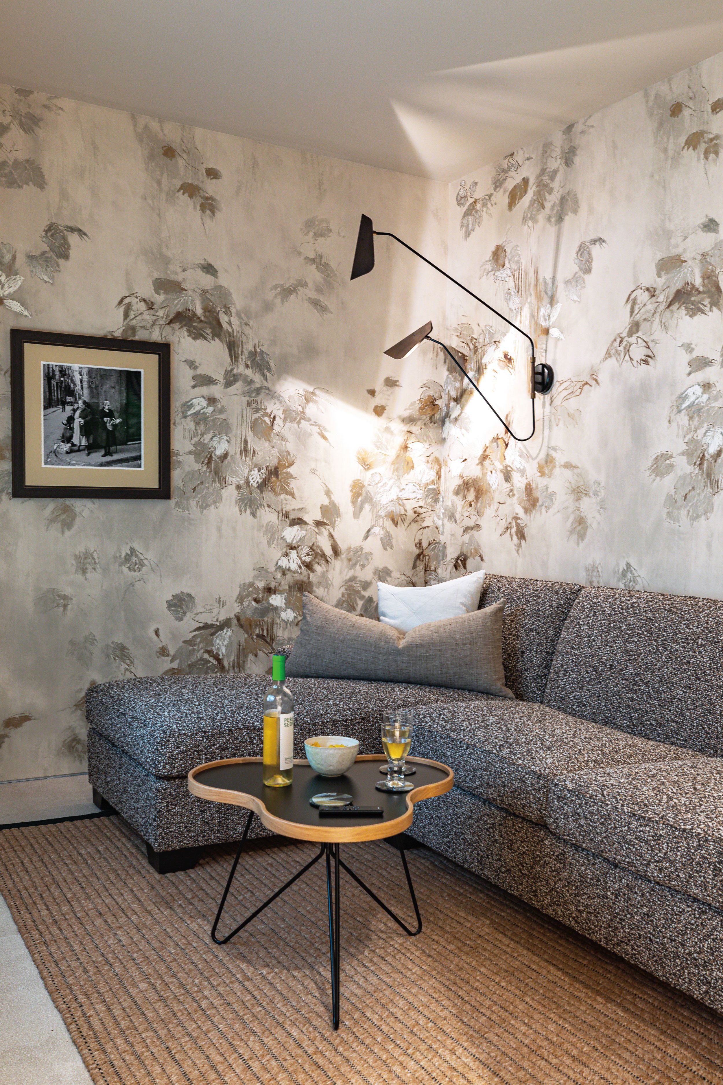 Image may contain: Home Decor, Art, Painting, Indoors, Interior Design, Couch, Furniture, Lamp, Person, Rug, and Architecture