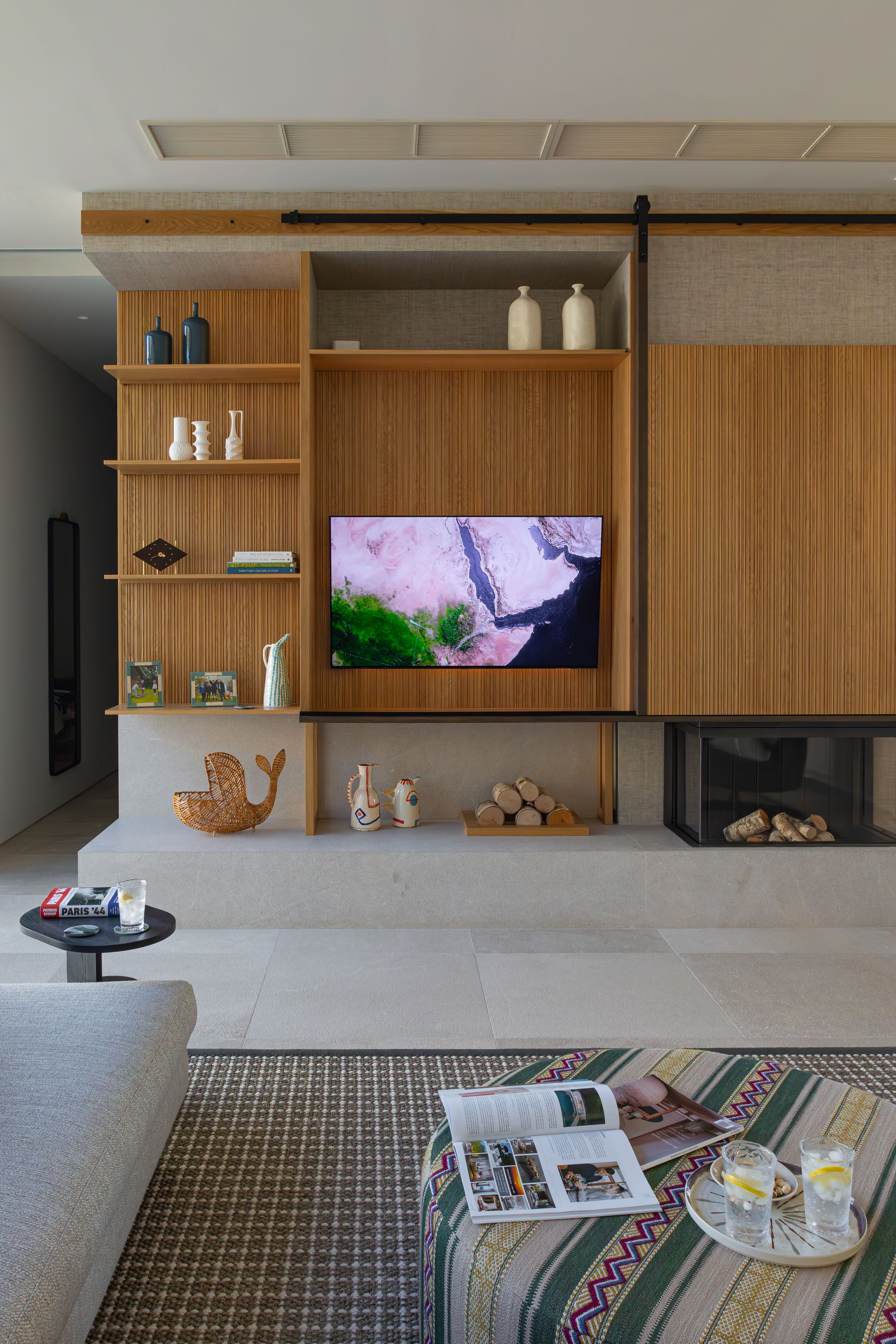 Image may contain: Indoors, Interior Design, Electronics, Entertainment Center, Cup, Architecture, Building, and Furniture