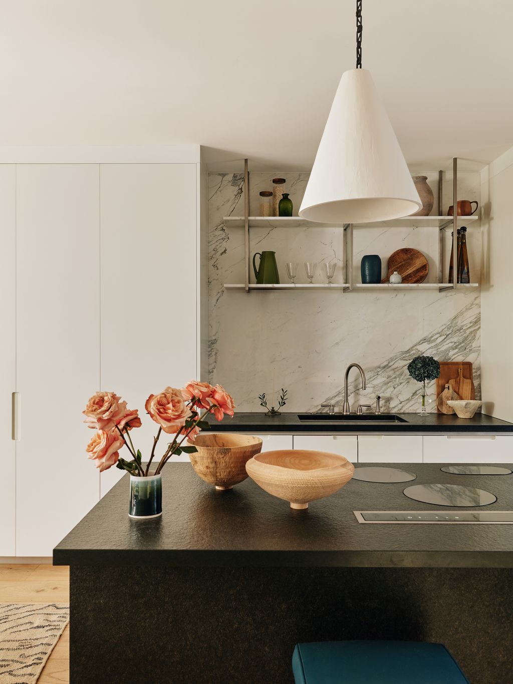 Image may contain Indoors Interior Design Kitchen Sink Sink Faucet Lamp Home Decor Rug Flower Plant and Furniture