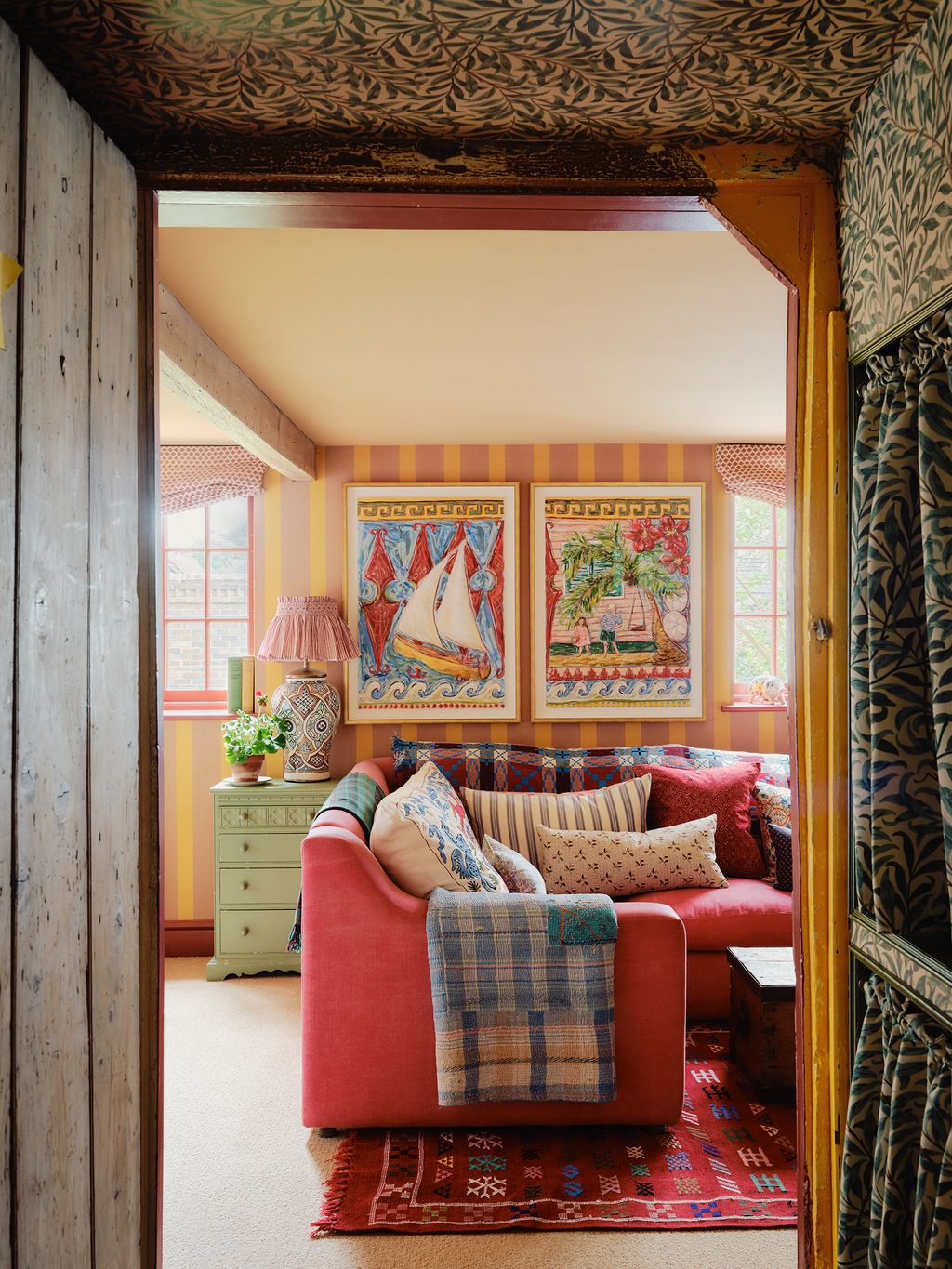 Image may contain Home Decor Indoors Interior Design Couch Furniture Lamp Rug Architecture Building and Living Room