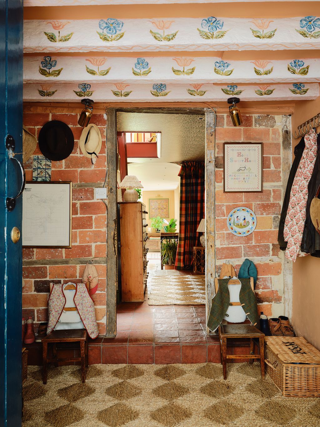 Image may contain Floor Flooring Indoors Interior Design Lamp Chair Furniture Plant Home Decor Rug and Clothing