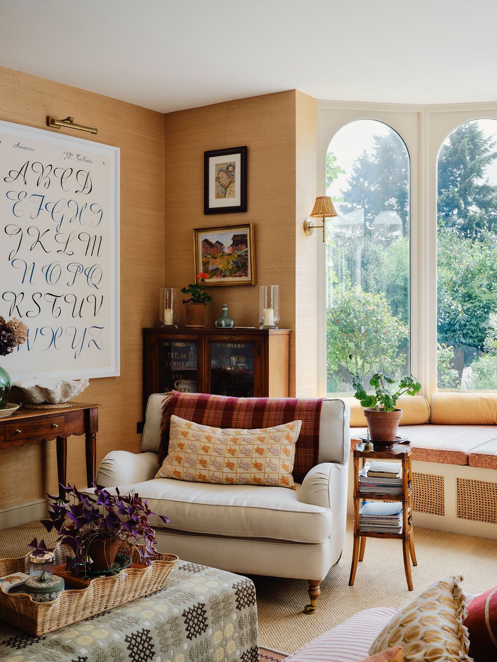 Image may contain Lamp Home Decor Couch Furniture Plant Desk Table Indoors Interior Design Cushion Candle and Art