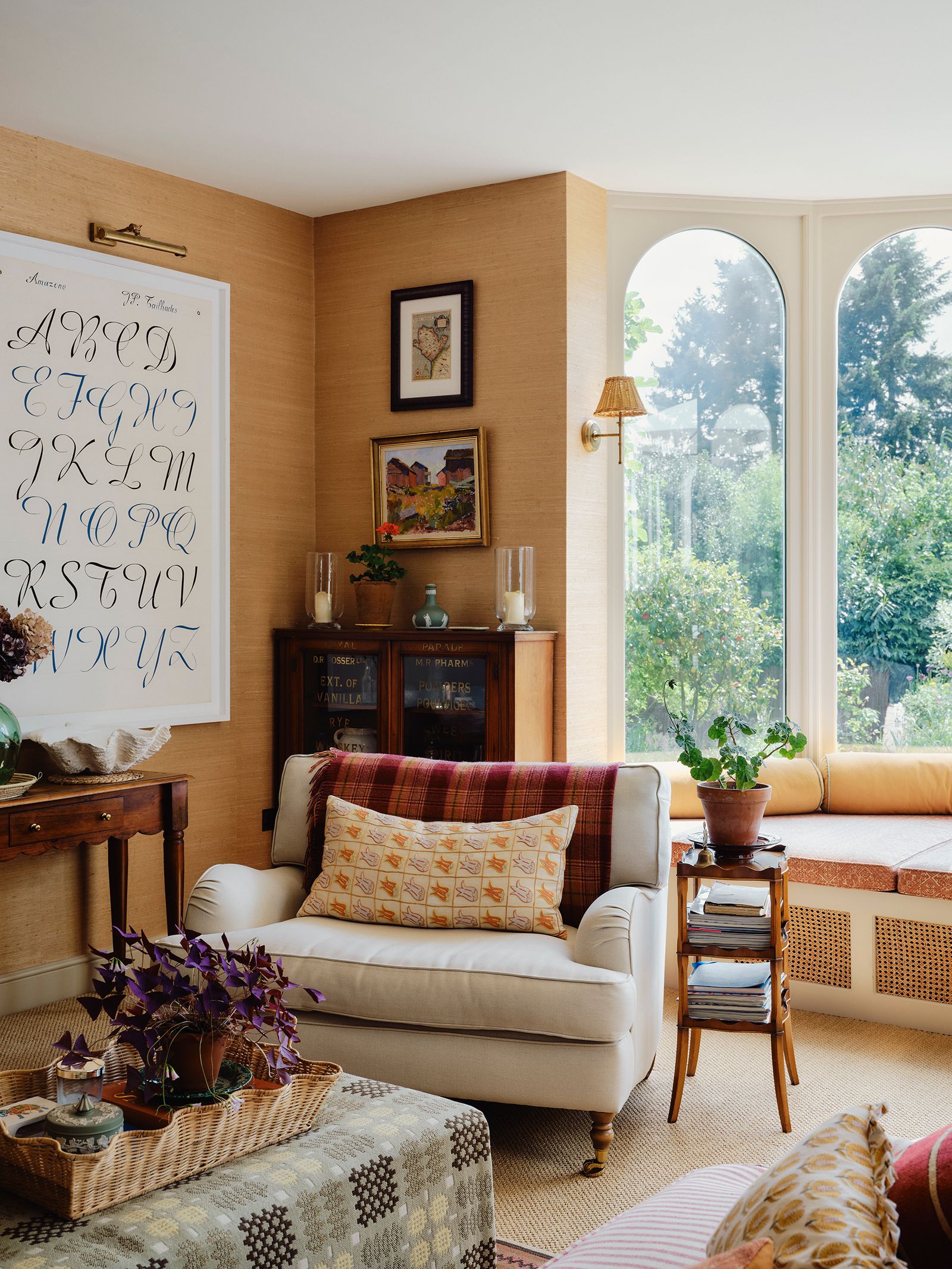 Image may contain Lamp Home Decor Couch Furniture Plant Desk Table Indoors Interior Design Cushion Candle and Art