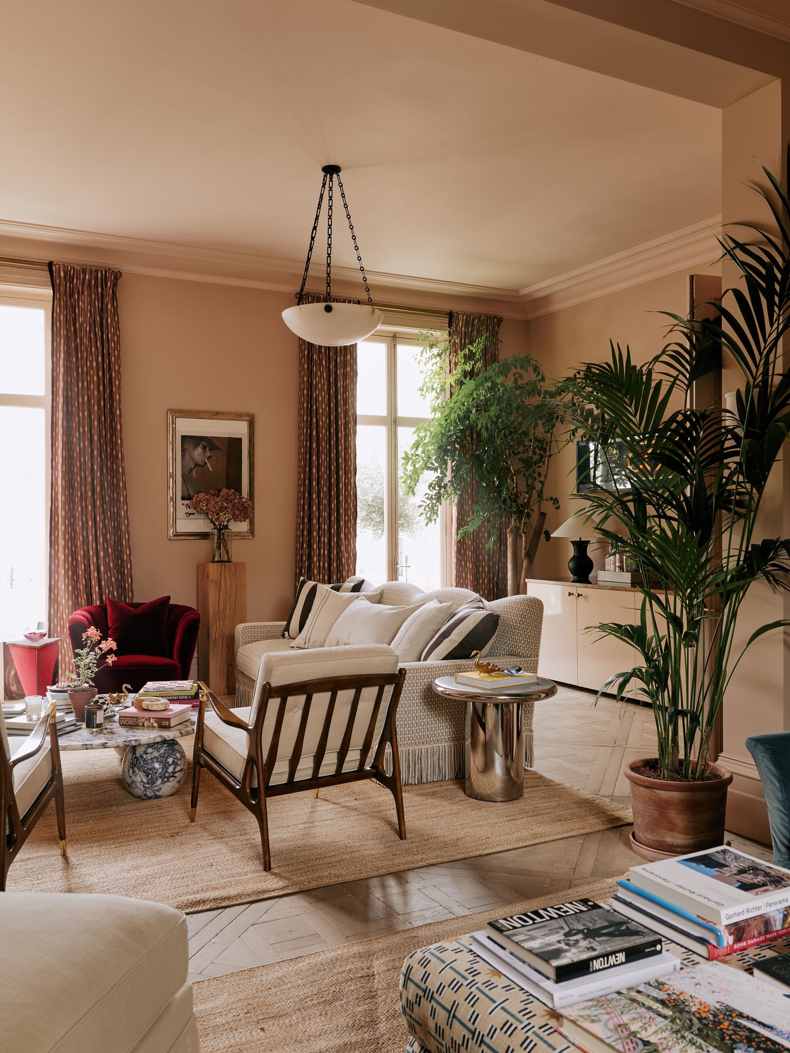 Image may contain Home Decor Lamp Plant Couch Furniture Architecture Building Indoors Living Room Room and Art