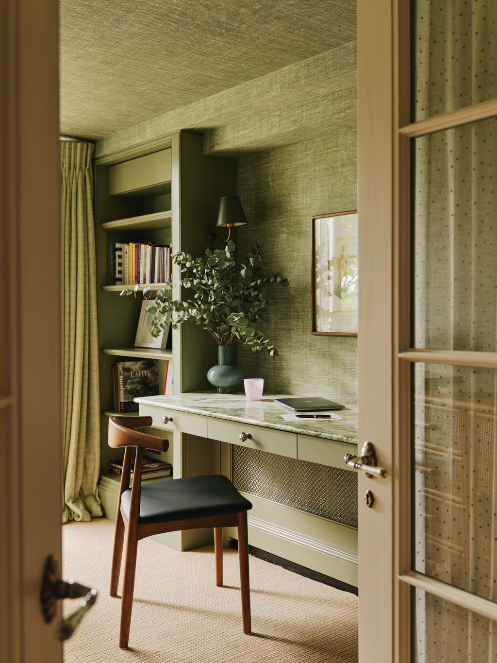 Image may contain Chair Furniture Cup Door Table Indoors Interior Design Art Painting Plant and Computer