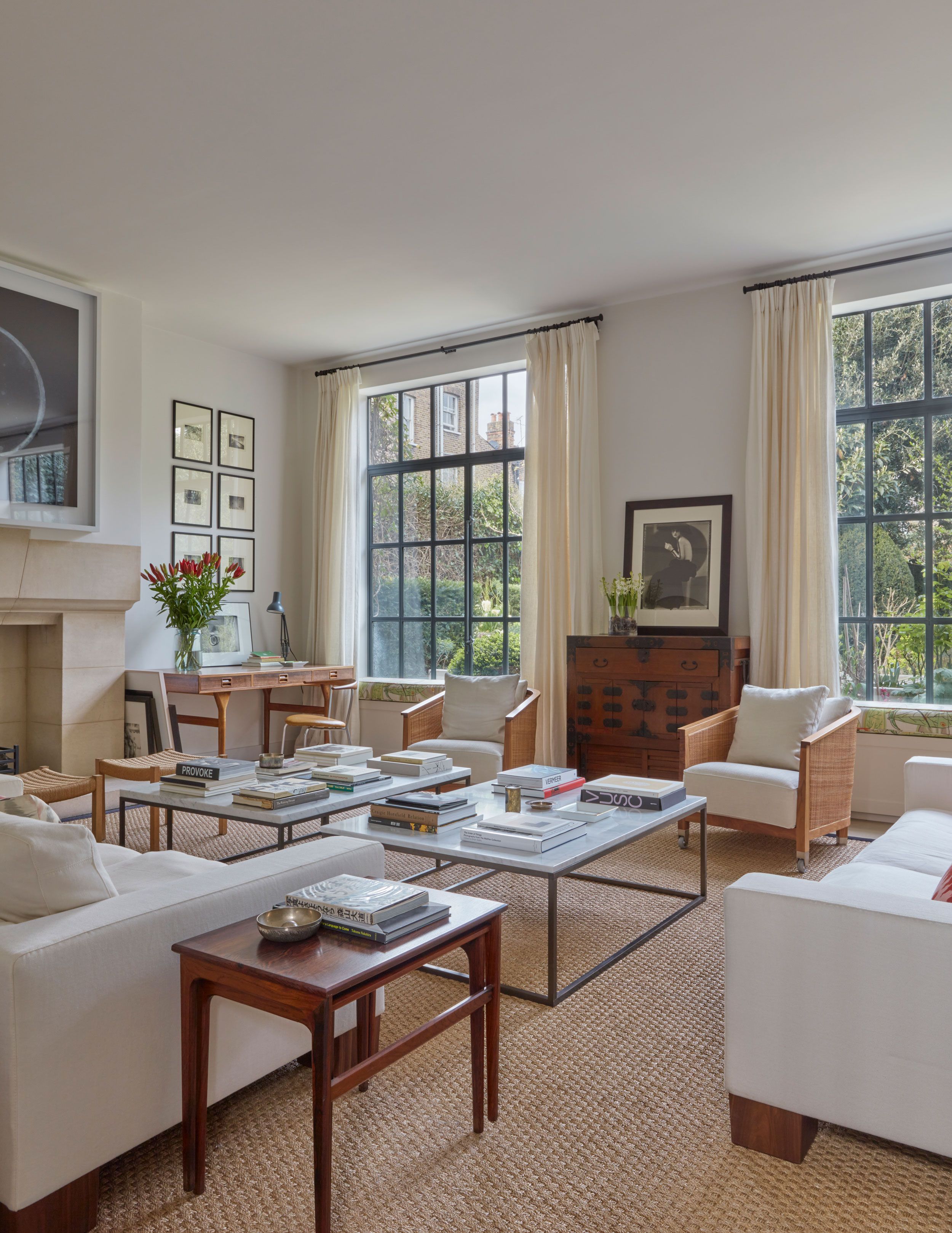 Image may contain: Home Decor, Coffee Table, Furniture, Table, Art, Painting, Couch, Desk, Chair, Architecture, and Building