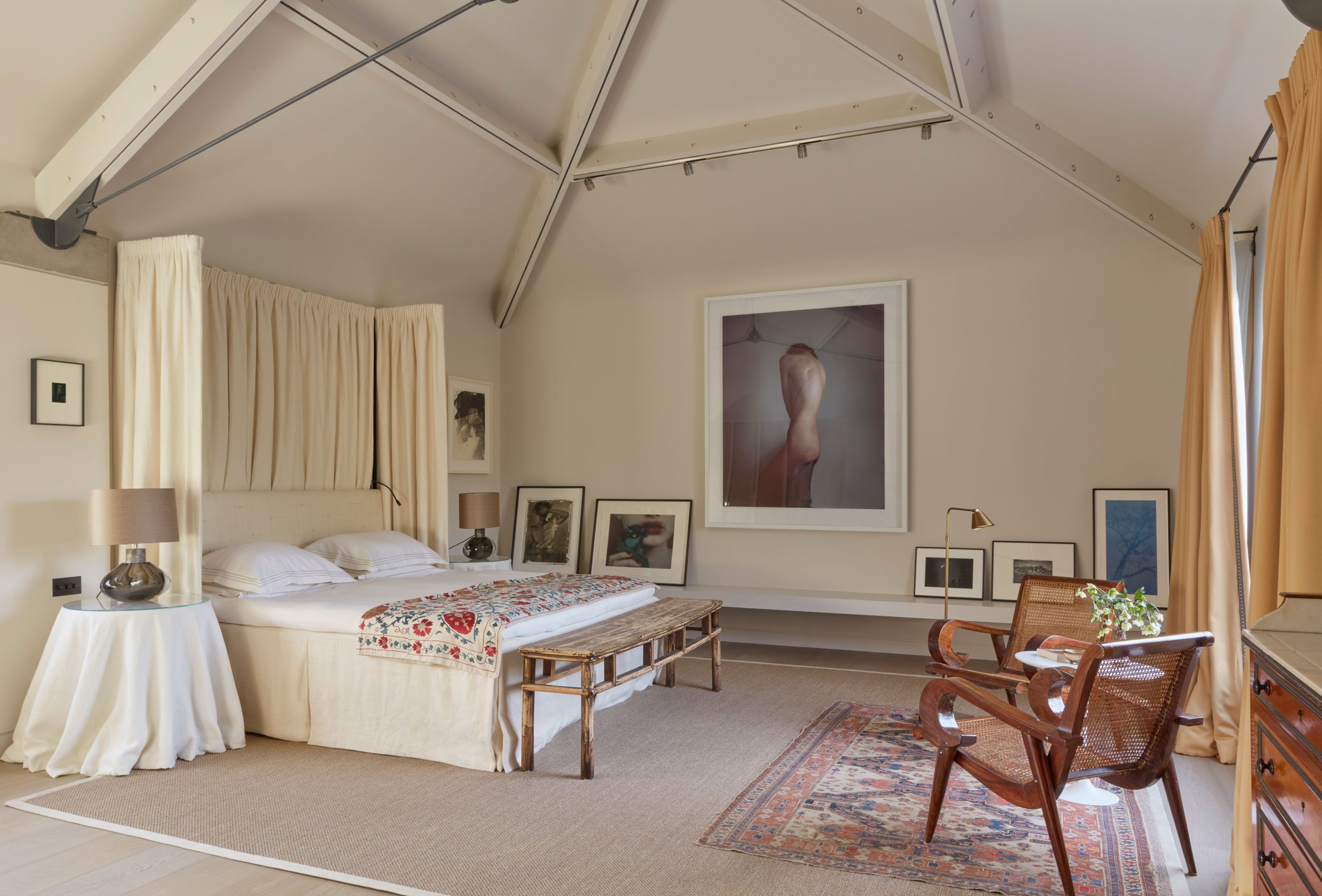 Image may contain: Lamp, Home Decor, Rug, Bench, Furniture, Art, Painting, Chair, Person, Indoors, Desk, Table, and Plant