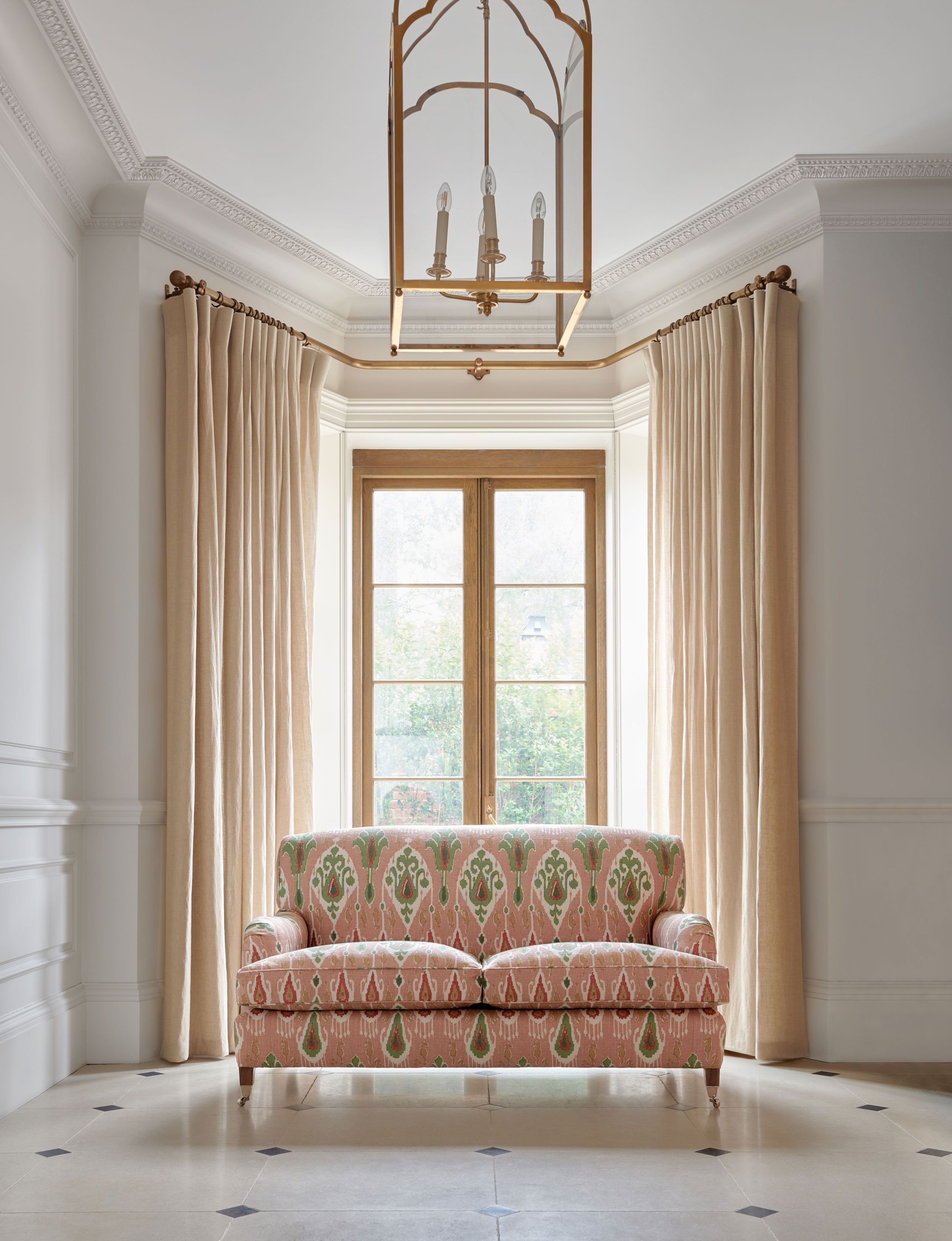 Image may contain: Window, French Window, Couch, Furniture, Bay Window, and Candle