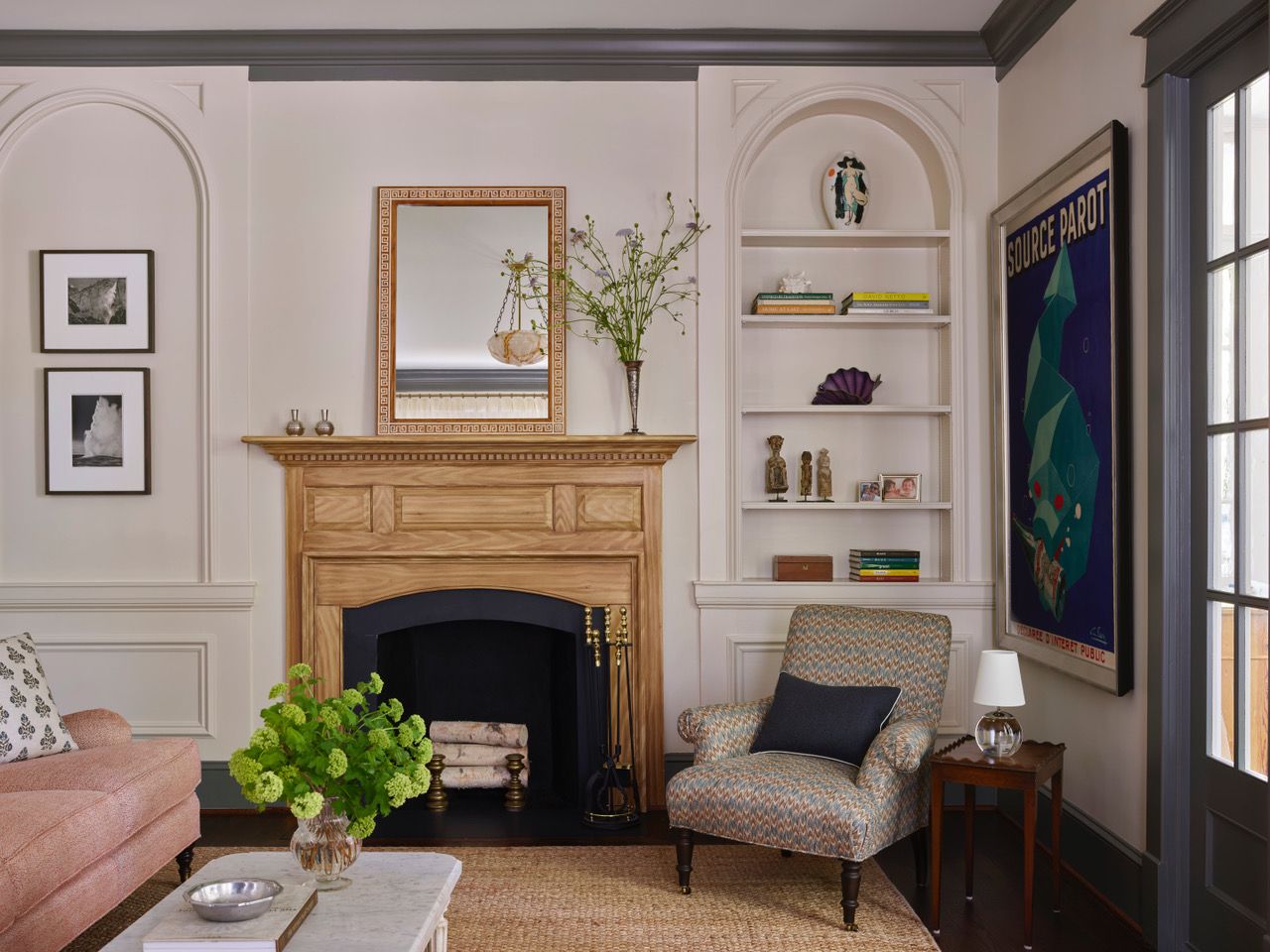 Image may contain: Home Decor, Indoors, Interior Design, Fireplace, Chair, Furniture, Lamp, Architecture, and Building