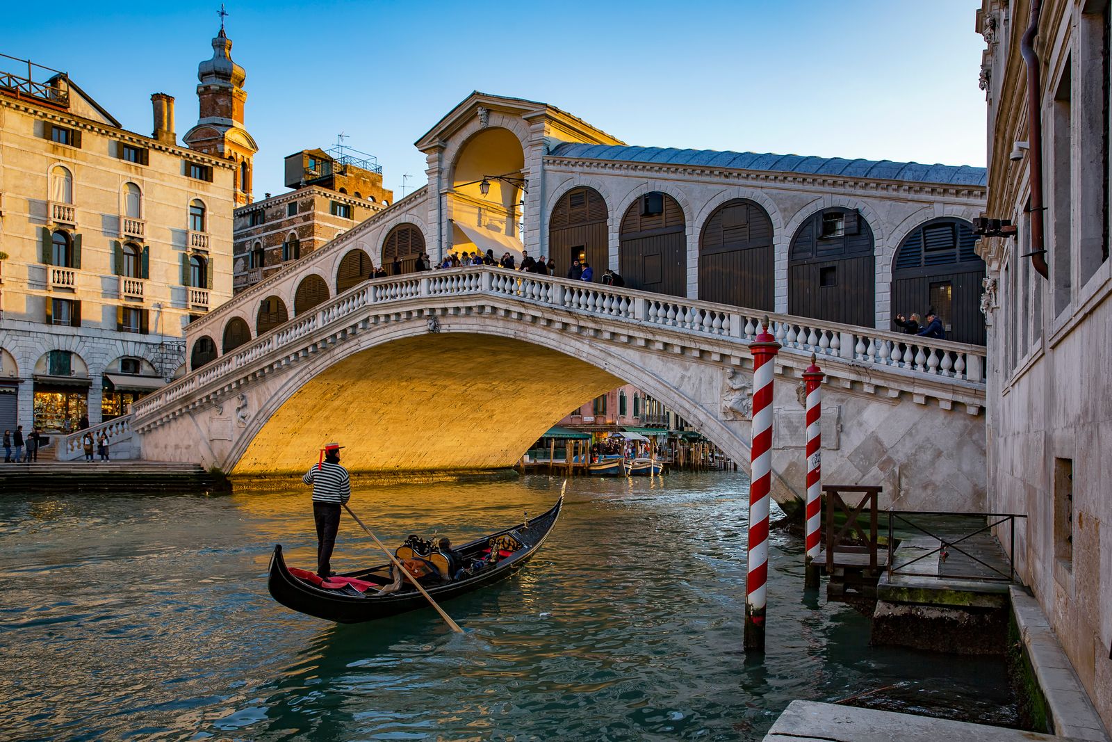 Image may contain Boat Transportation Vehicle Person Bridge Landmark and Rialto Bridge