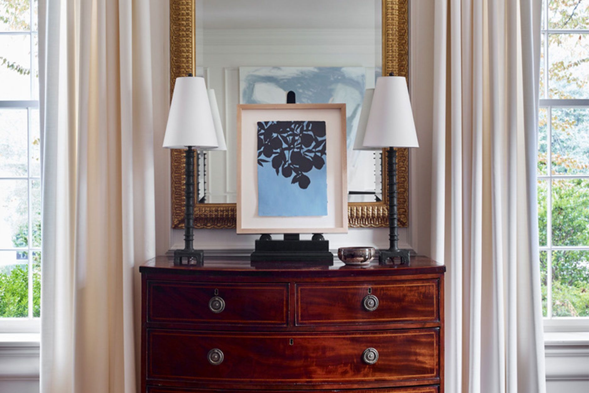 Image may contain: Cabinet, Furniture, Lamp, Art, Painting, Sideboard, and Table Lamp