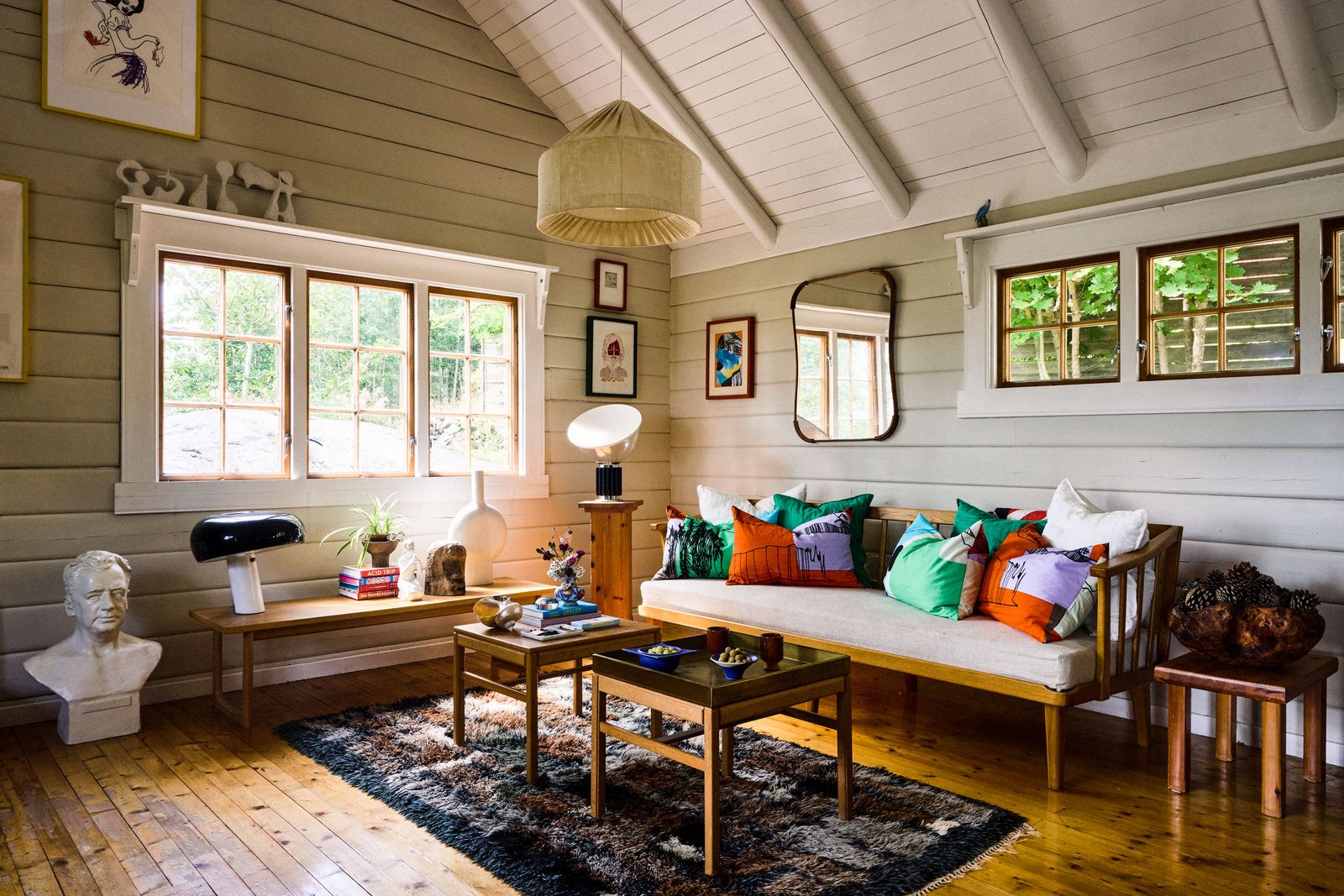 Image may contain Home Decor Indoors Interior Design Cushion Rug Couch Furniture Adult Person Art and Painting