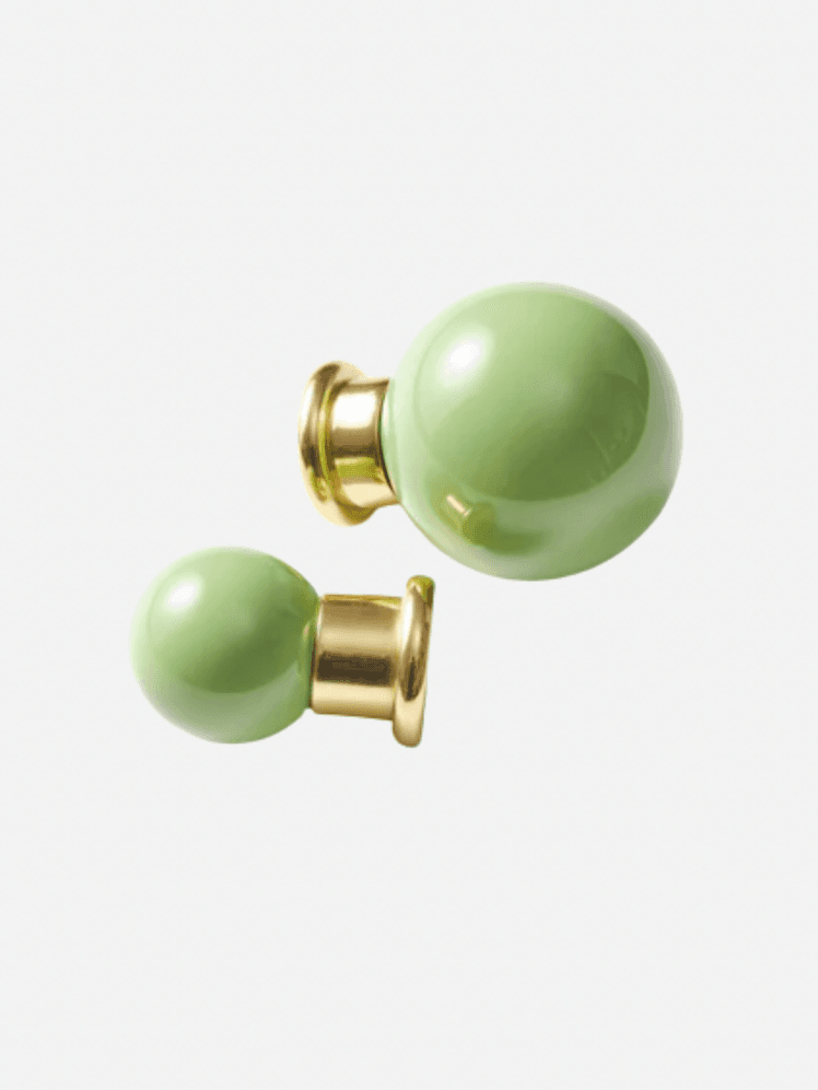 Image may contain: Accessories, Earring, Jewelry, Smoke Pipe, and Gemstone