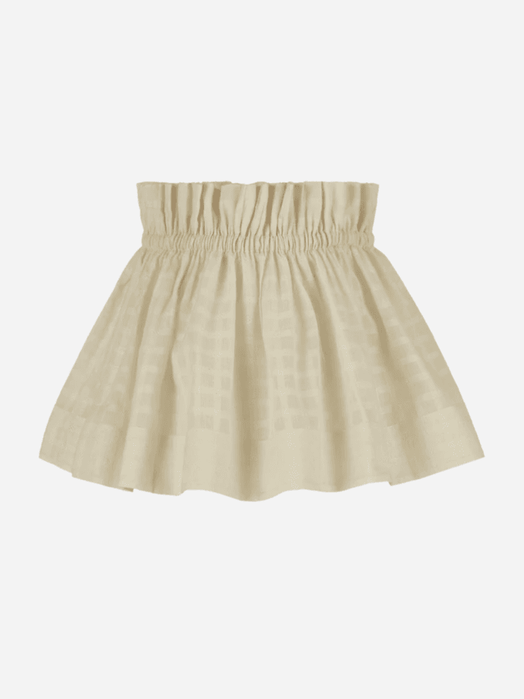 Image may contain: Clothing, Skirt, Miniskirt, and Blouse