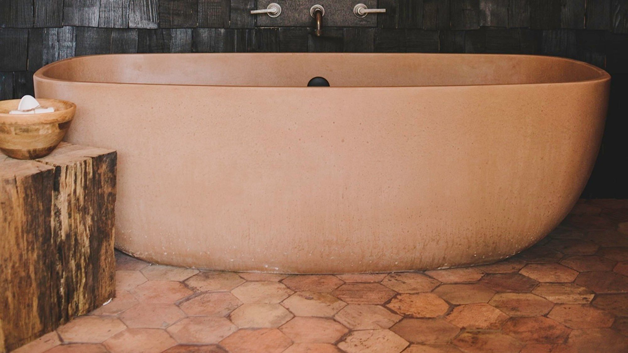 Image may contain: Tub, Bathing, Bathtub, Person, and Hot Tub