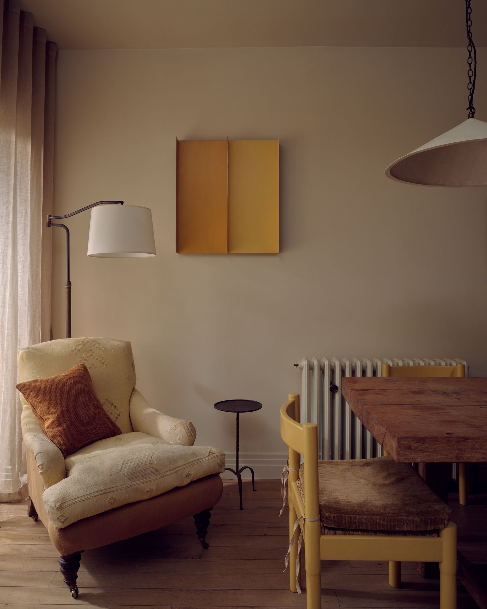 Image may contain Lamp Furniture Chair Home Decor Desk Table and Cushion