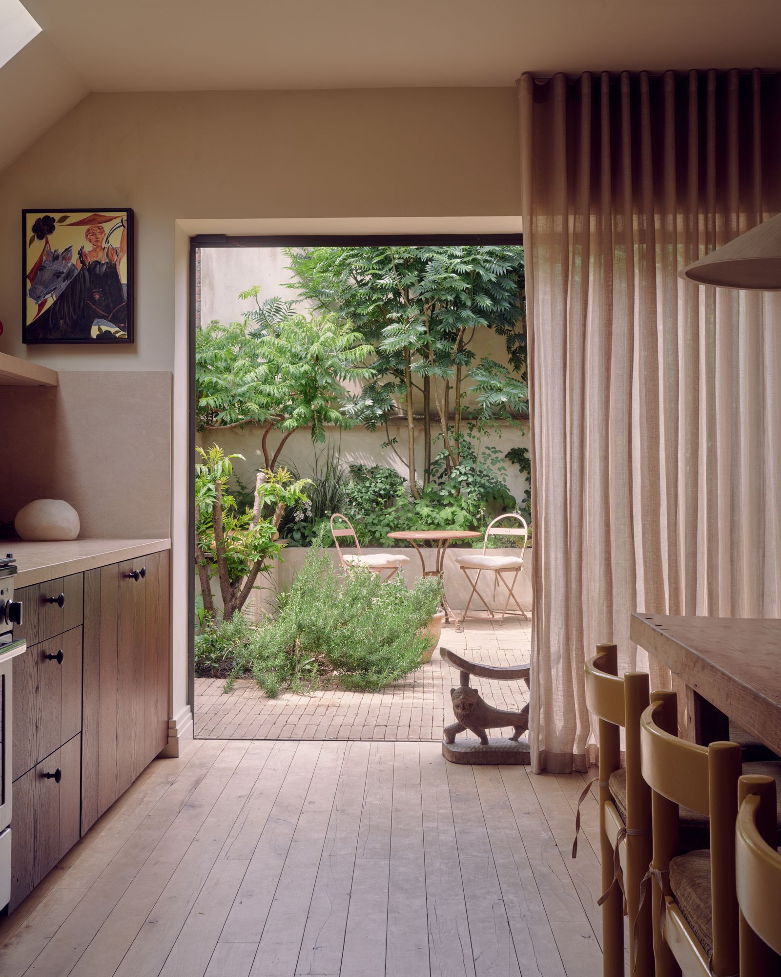 Image may contain Indoors Interior Design Chair Furniture Art Painting Architecture Balcony Building and Desk