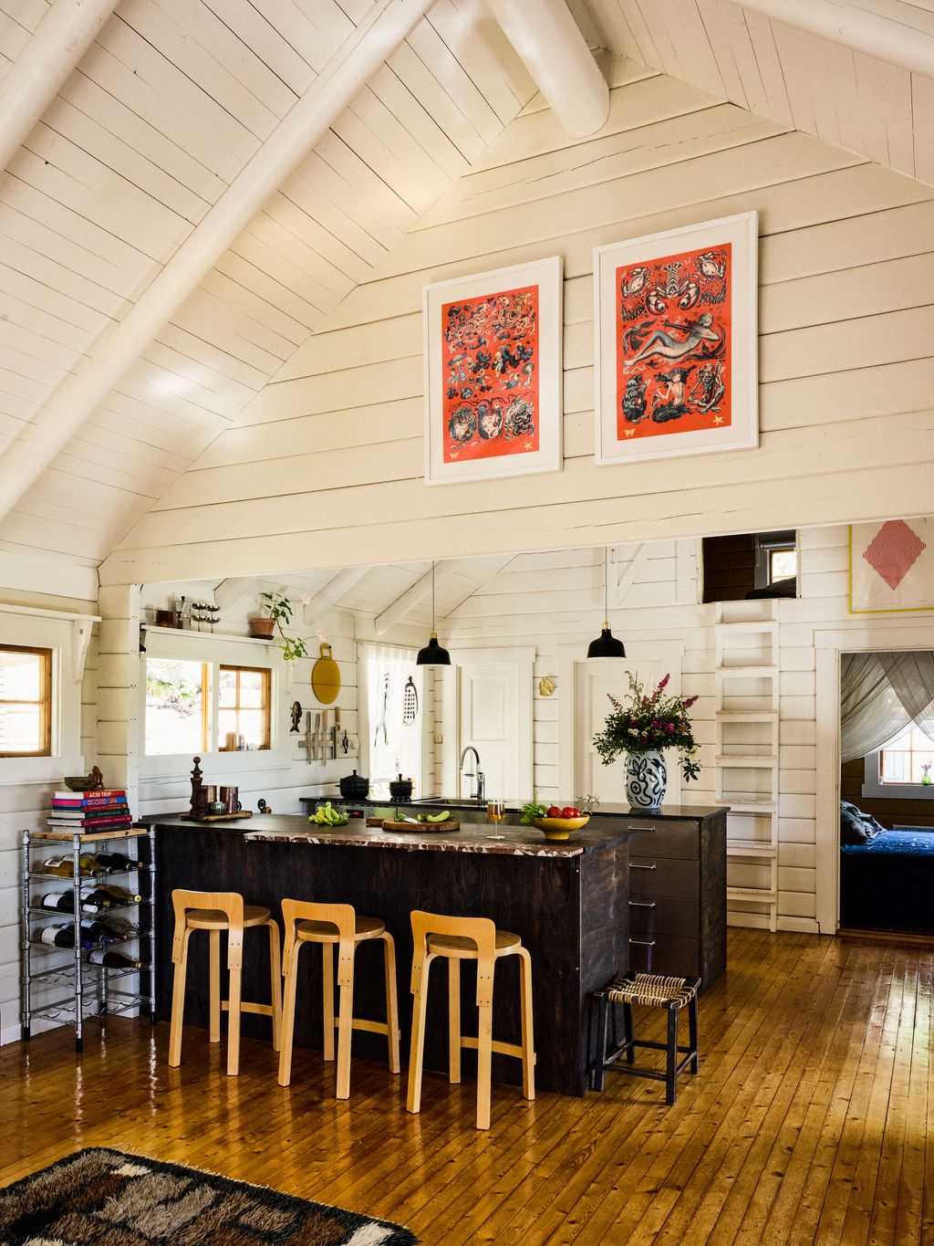 Image may contain Indoors Interior Design Wood Hardwood Lamp Home Decor Rug Floor Sink Sink Faucet and Kitchen