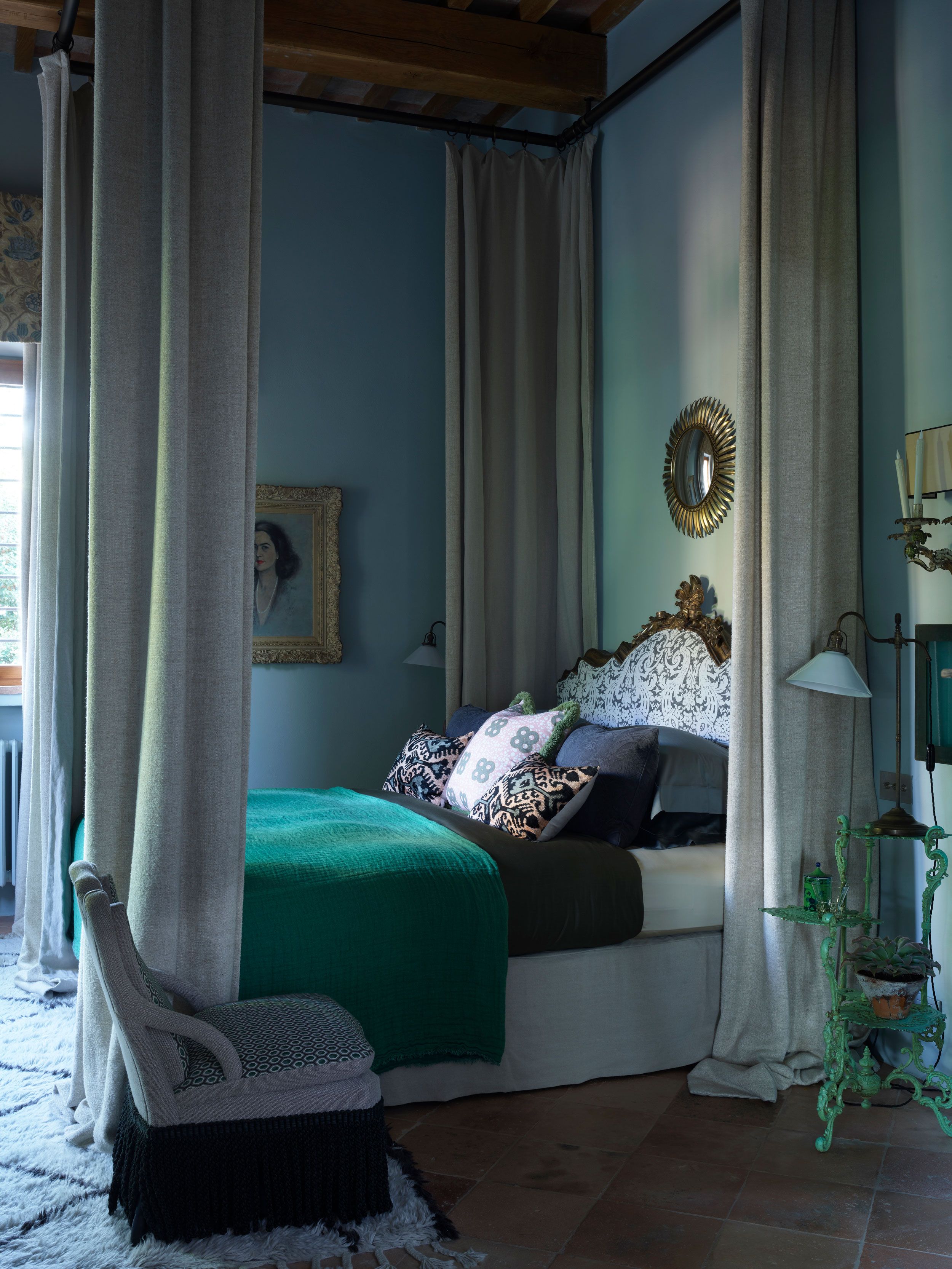 Image may contain: Furniture, Bed, Bedroom, Indoors, Room, Art, Painting, Chair, Plant, Person, Lamp, Candle, and Canopy Bed