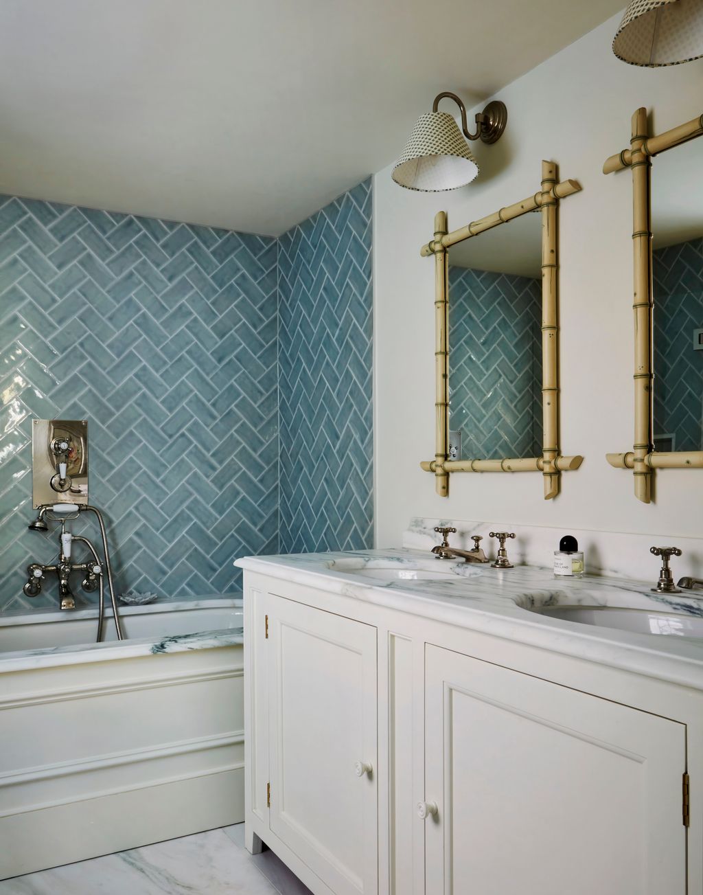 Image may contain Indoors Interior Design Sink Sink Faucet Lamp Bathing Bathtub Person and Tub