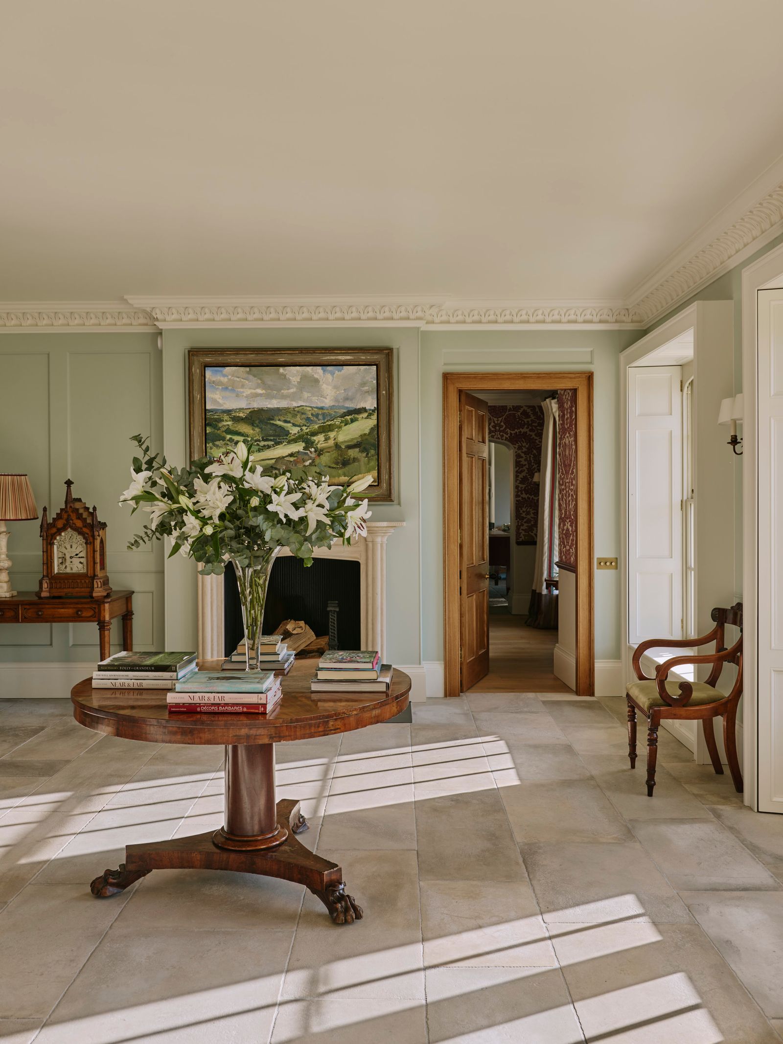 Image may contain Floor Flooring Lamp Chair Furniture Desk Table Indoors Interior Design Art and Painting