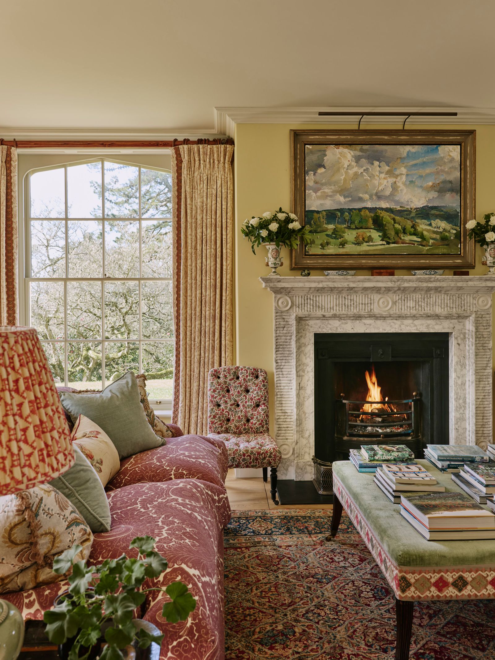 Image may contain Home Decor Fireplace Indoors Chair Furniture Art Painting Rug Architecture and Building