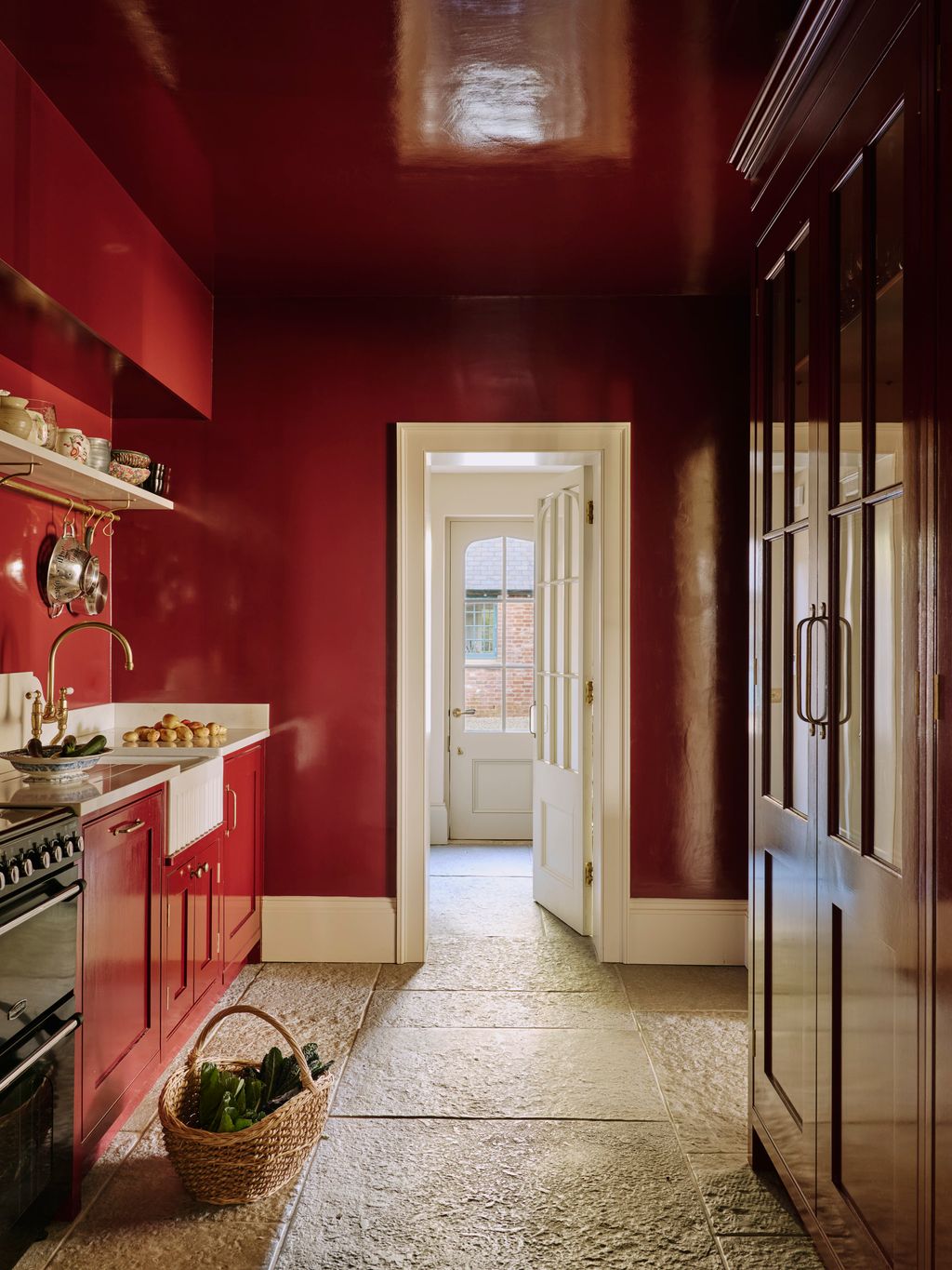 Image may contain Floor Indoors Interior Design Flooring Sink Sink Faucet and Kitchen