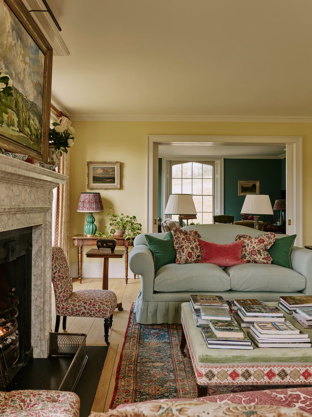 Image may contain Home Decor Lamp Chair Furniture Couch Architecture Building Indoors Living Room Room and Rug