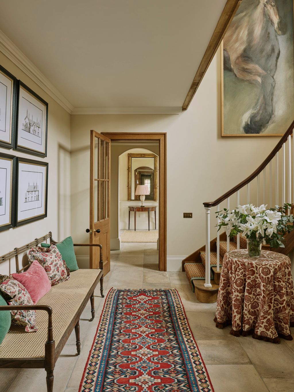 Image may contain Lamp Home Decor Indoors Rug Desk Furniture Table Bench Architecture Building Foyer and Art