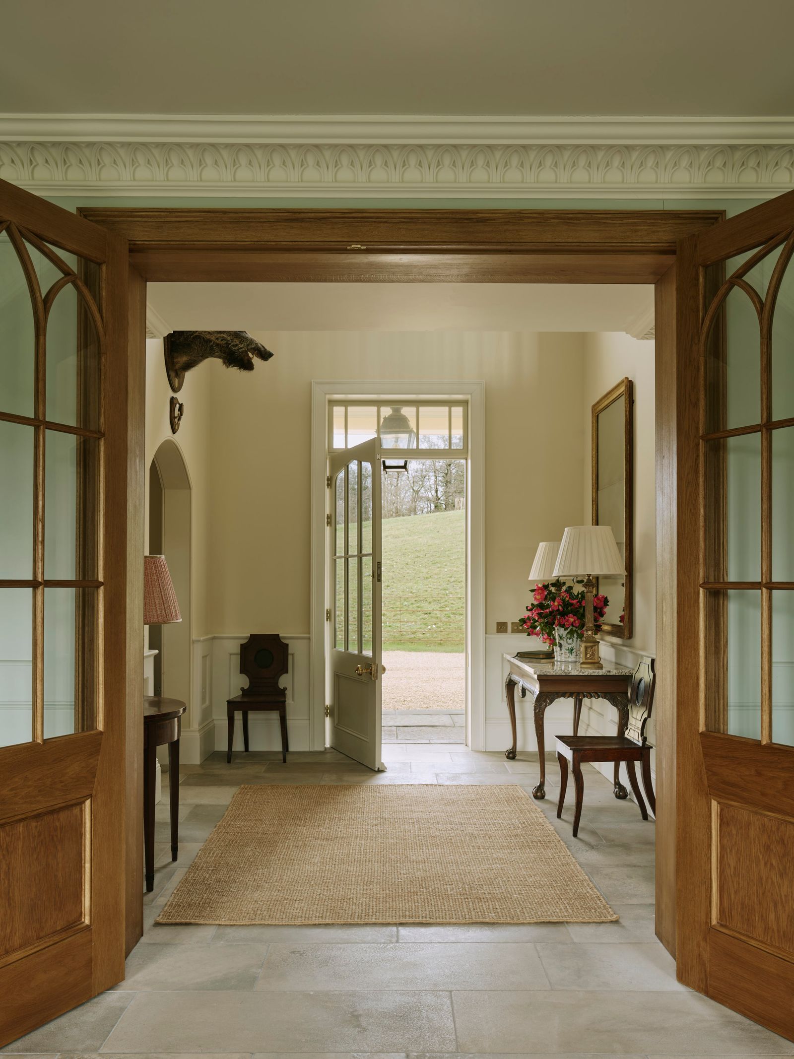 Image may contain Door Desk Furniture Table Chair Home Decor Rug Lamp Indoors Interior Design Art and Painting