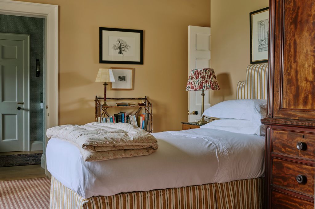 Image may contain Lamp Table Lamp Art Painting Indoors Interior Design Bed Furniture Home Decor Rug and Cushion