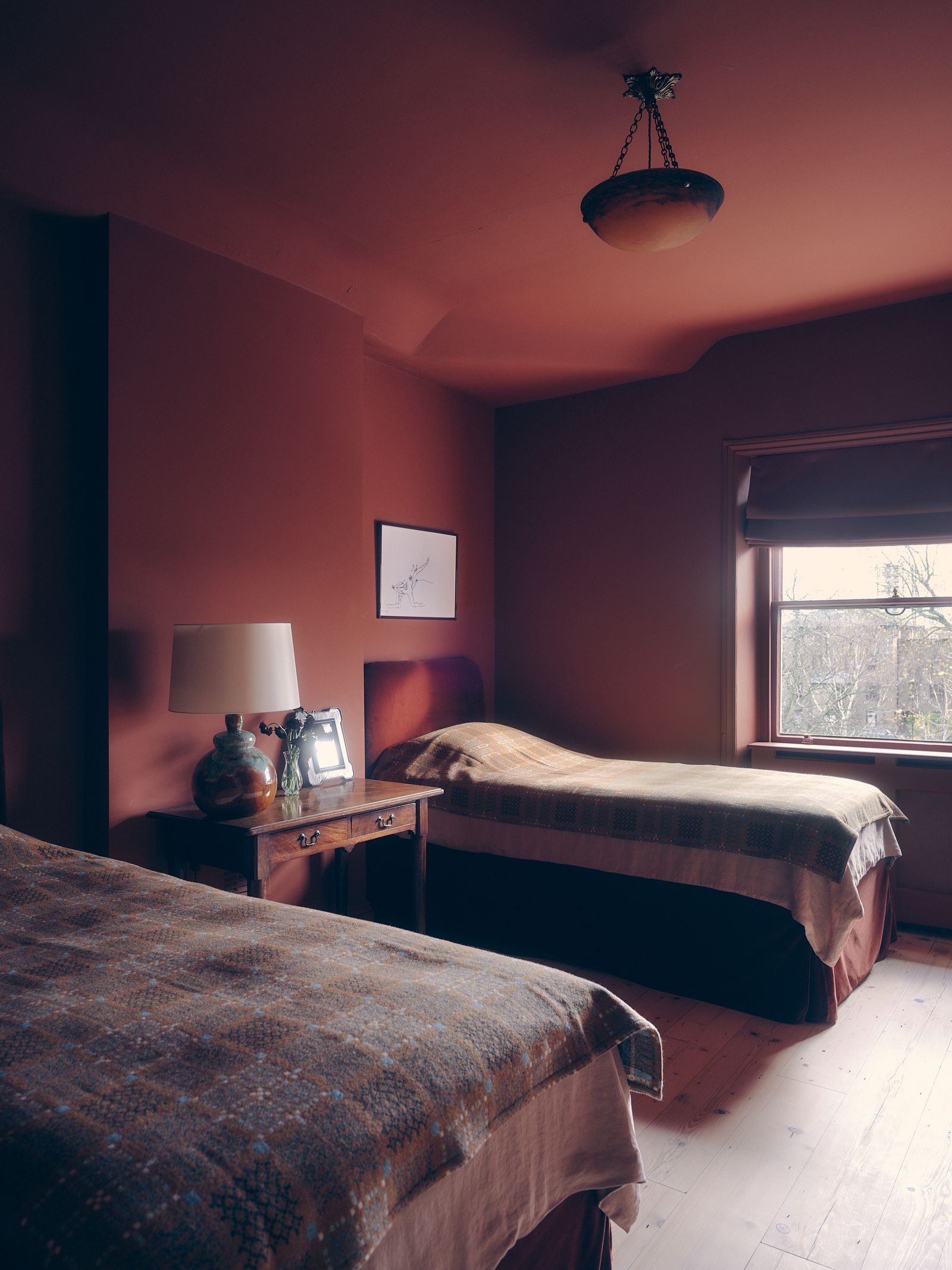 Image may contain Lamp Bed Furniture Bedroom Dorm Room Indoors Room Art Painting Desk and Table