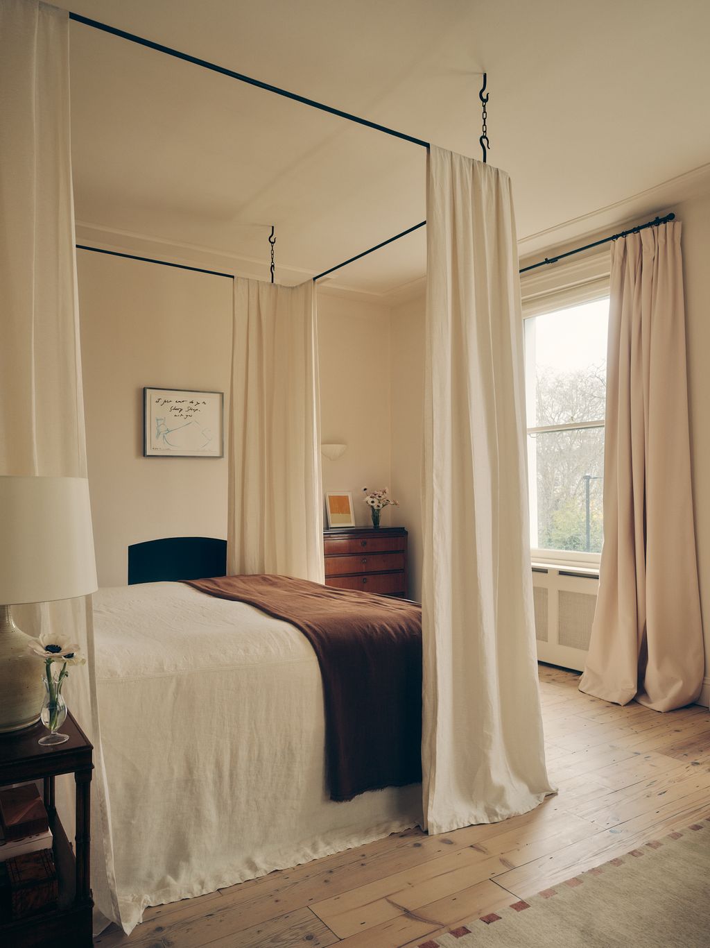 Image may contain Furniture Bed Bedroom Indoors Room Lamp Art Painting Home Decor Rug and Canopy Bed