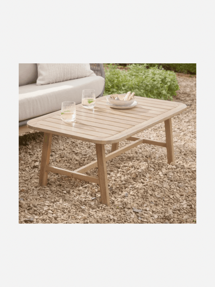 Image may contain: Coffee Table, Furniture, Table, Tabletop, Dining Table, Couch, Indoors, and Interior Design