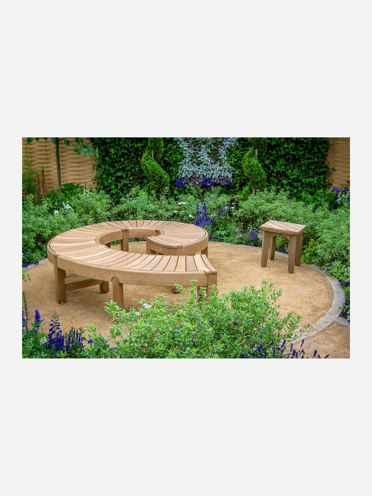 Image may contain: Garden, Nature, Outdoors, Bench, Furniture, Backyard, Yard, Coffee Table, Table, Wood, Grass, and Plant