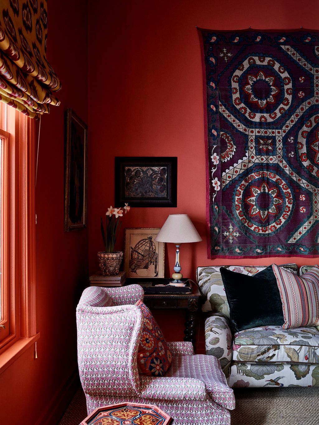 Image may contain Home Decor Lamp Architecture Building Furniture Indoors Living Room Room Cushion and Art