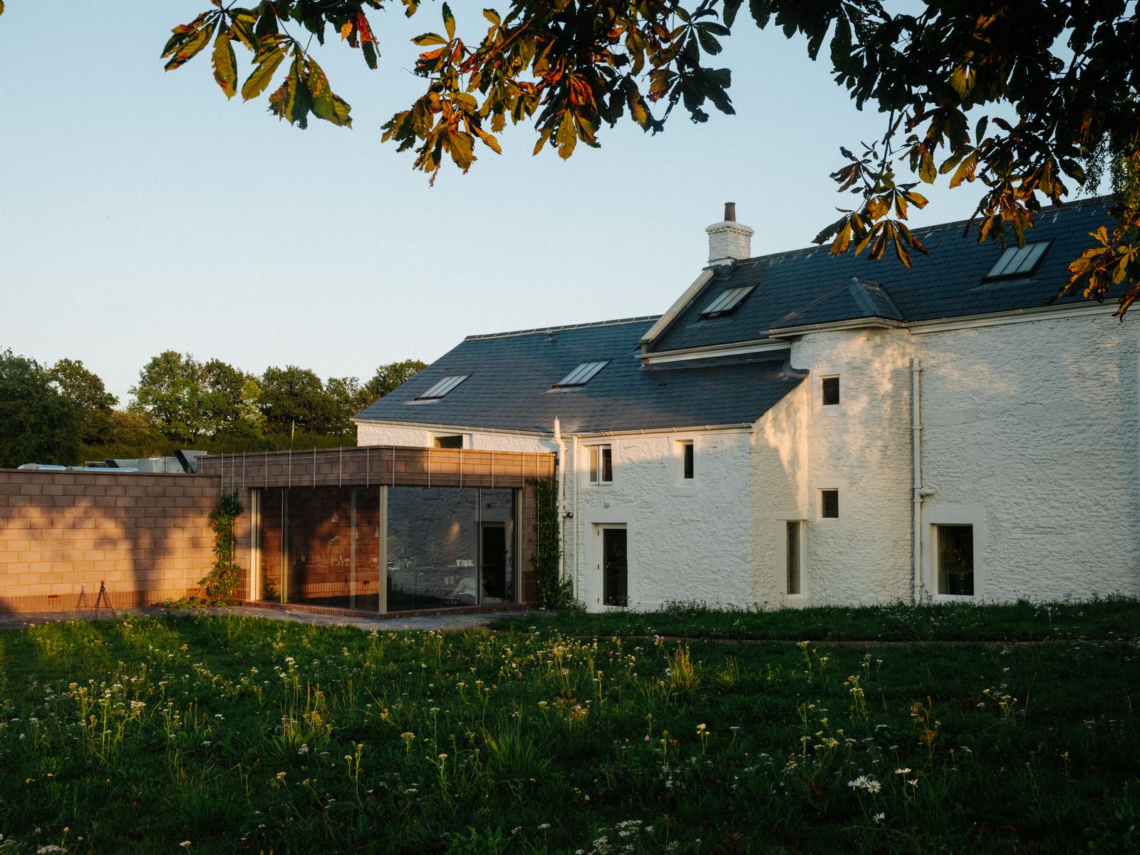 Image may contain Grass Plant Architecture Building House Housing Villa Lawn Backyard Nature Outdoors and Yard